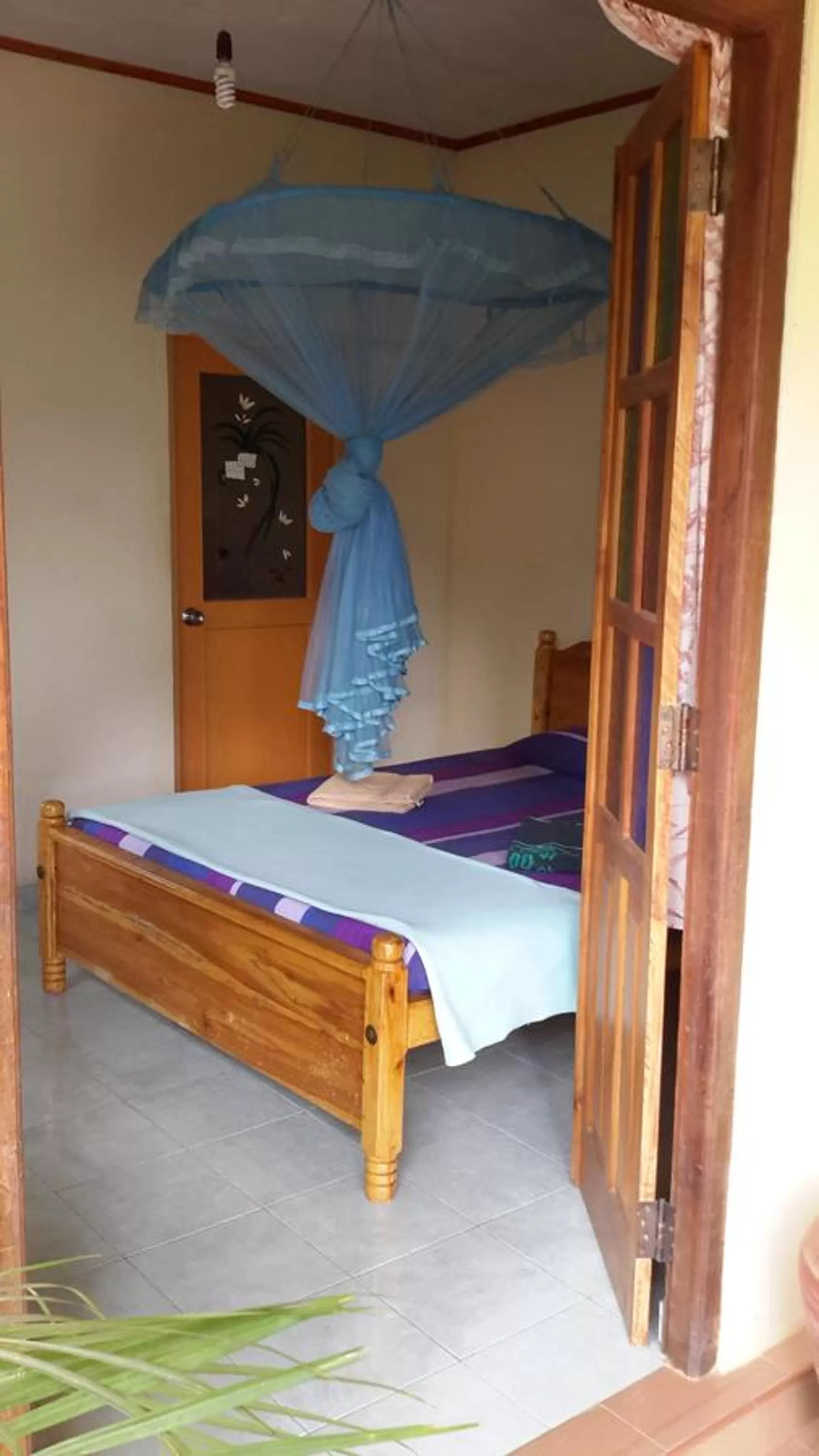 Bed in Raveena Guest House