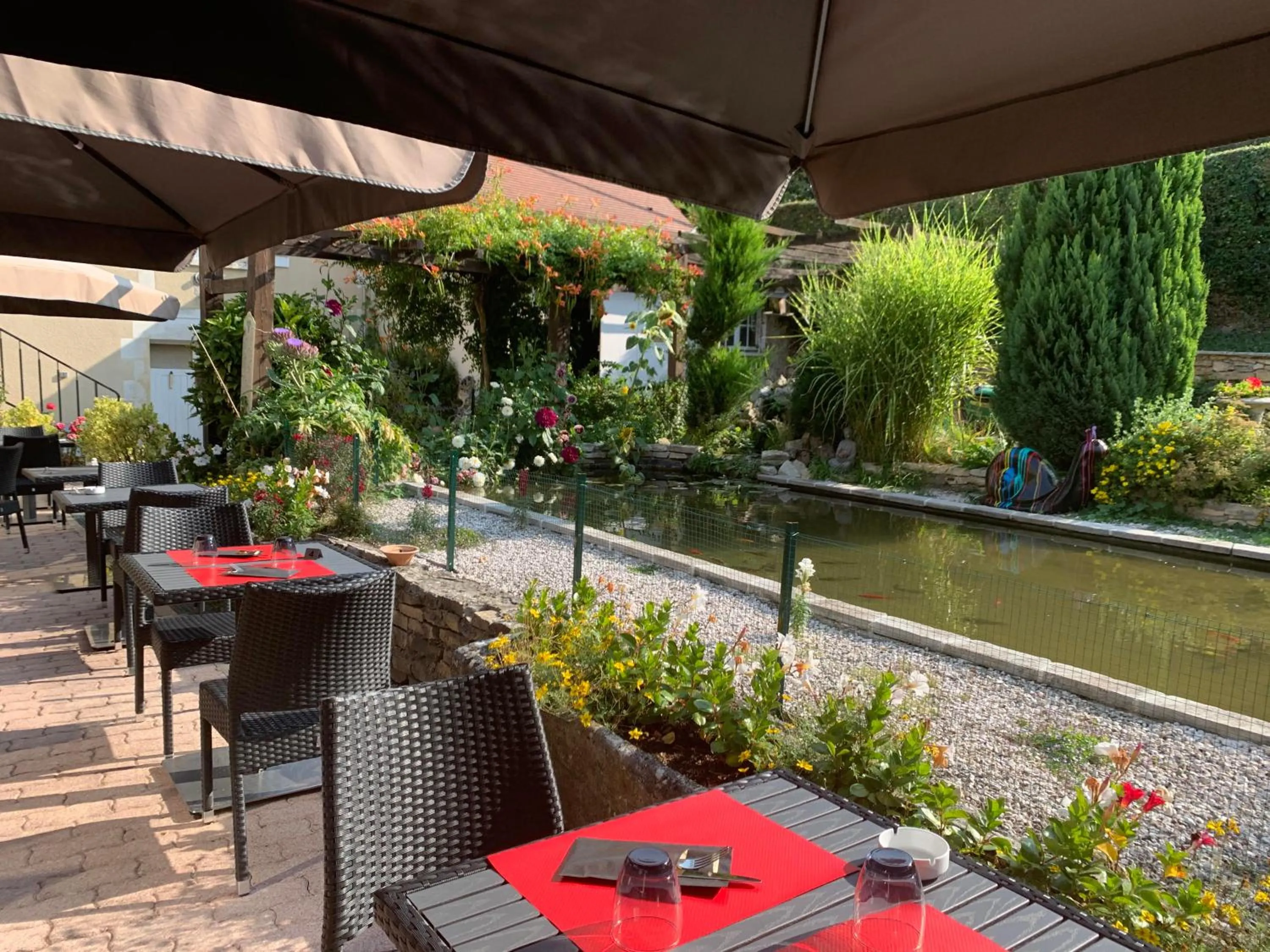 Patio in Logis Hôtel Restaurant Le Moulin de la Coudre
