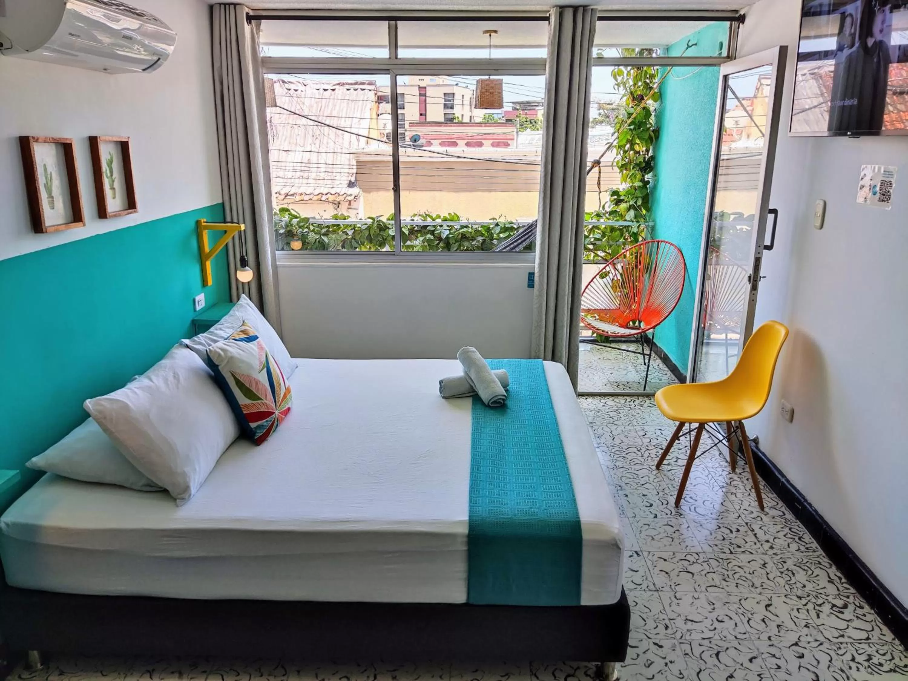 Bed in Bona Vida Hotel