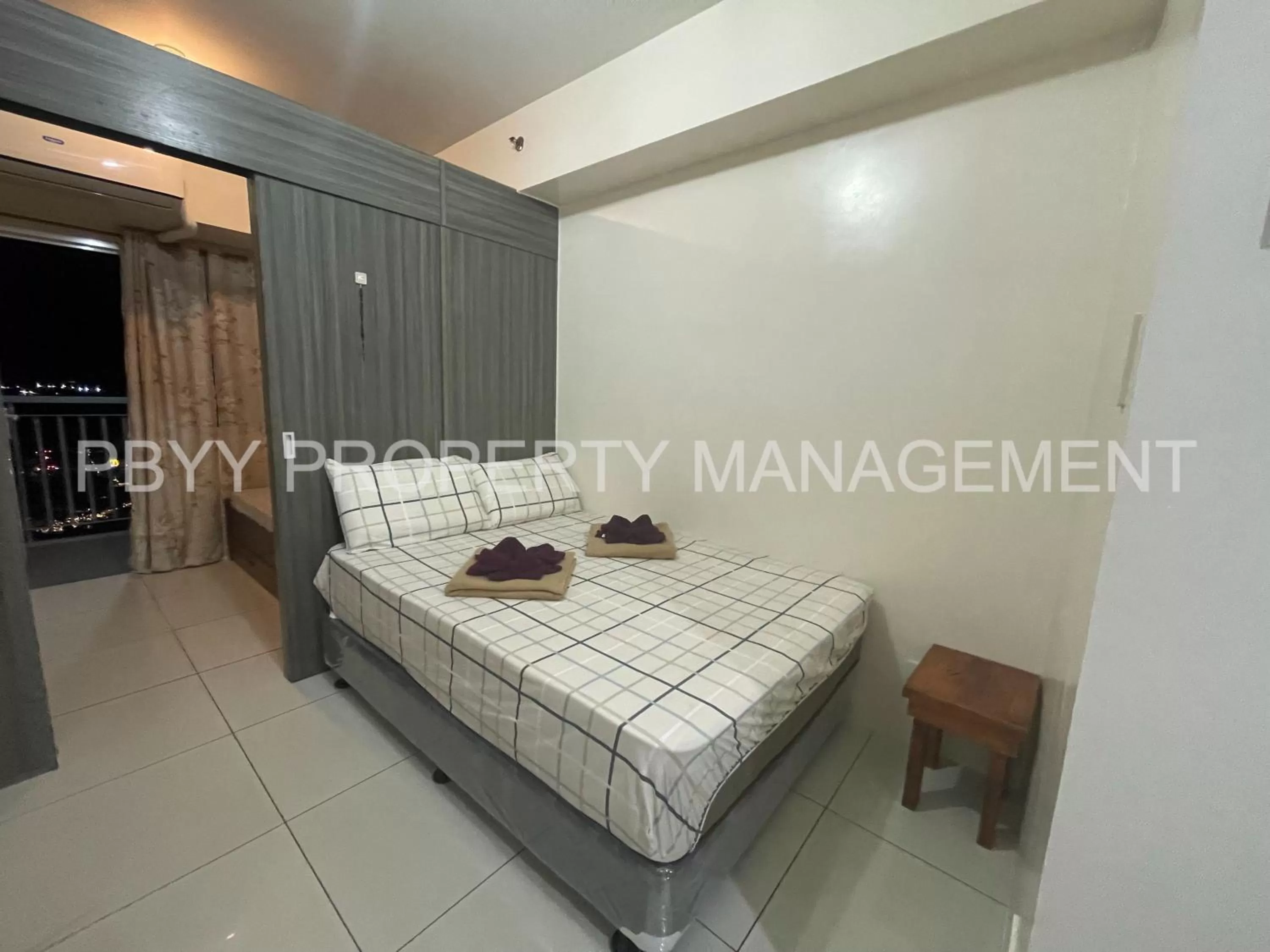 Photo of the whole room, Bed in Green Residences Staycation by PBYY