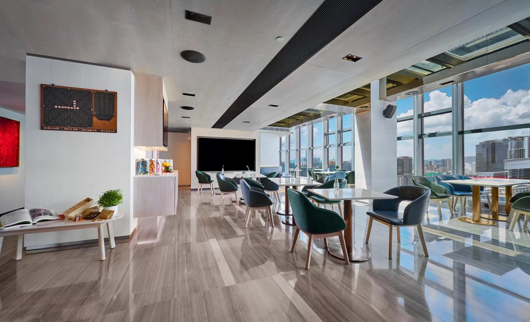 Communal lounge/ TV room in Nina Hotel Kowloon East