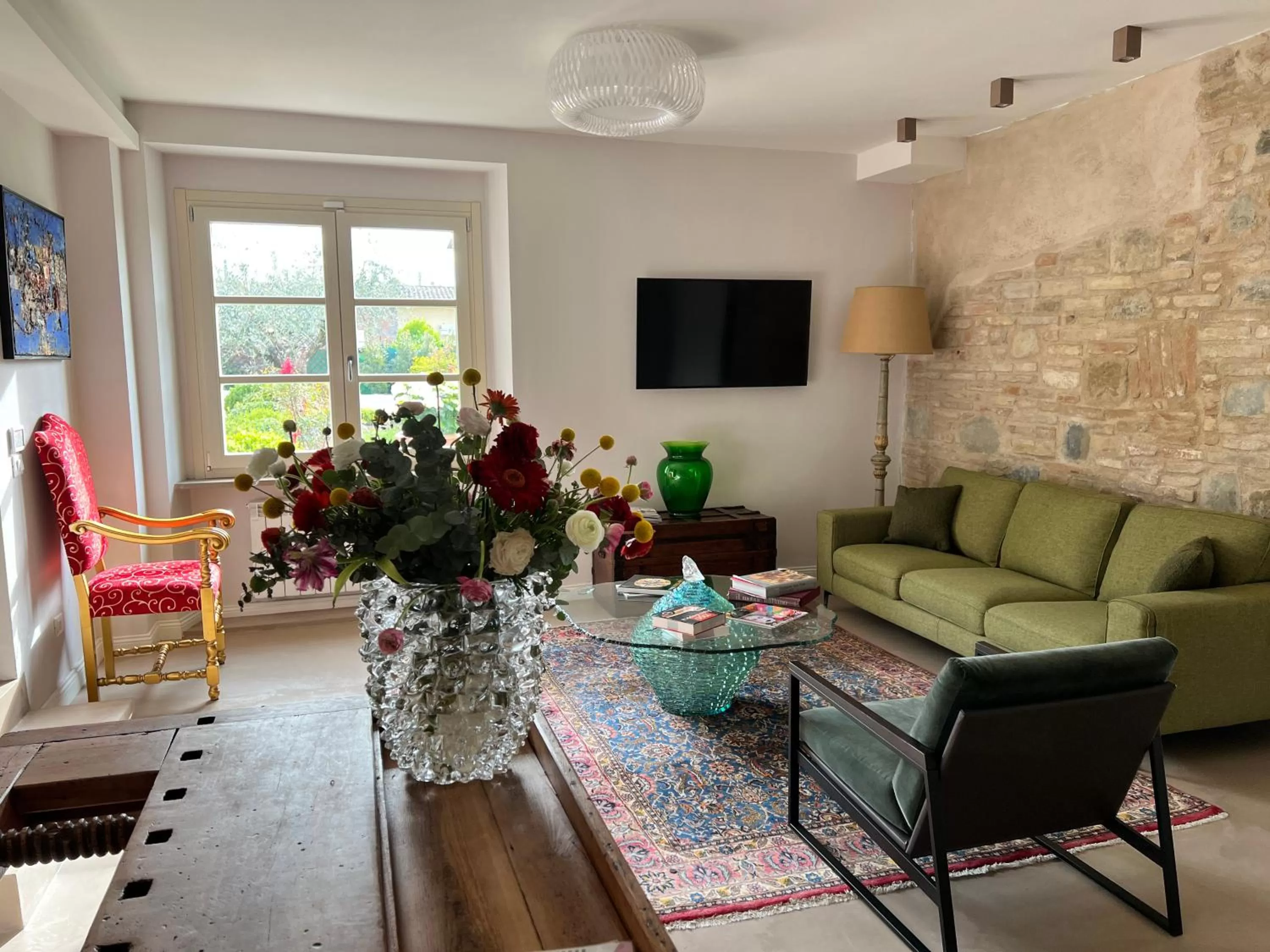 Communal lounge/ TV room in CorteViva Boutique B&B