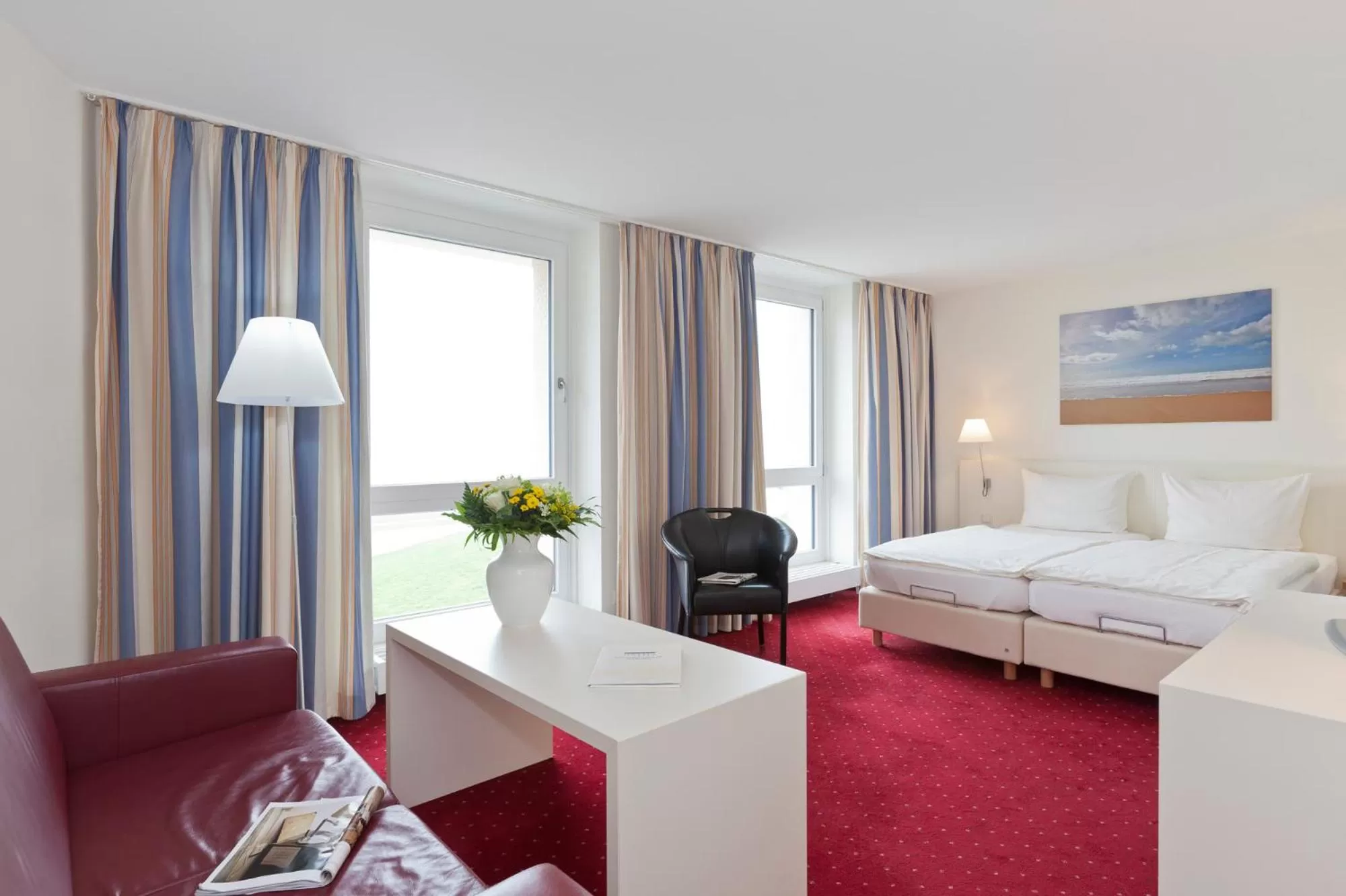 Photo of the whole room, Bed in Michels Strandhotel Germania