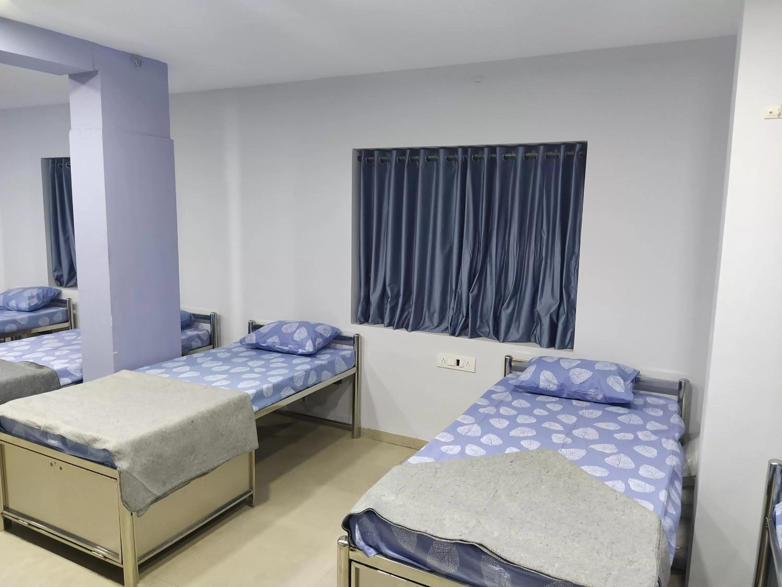 Bed in Shiv Sai Dormitory
