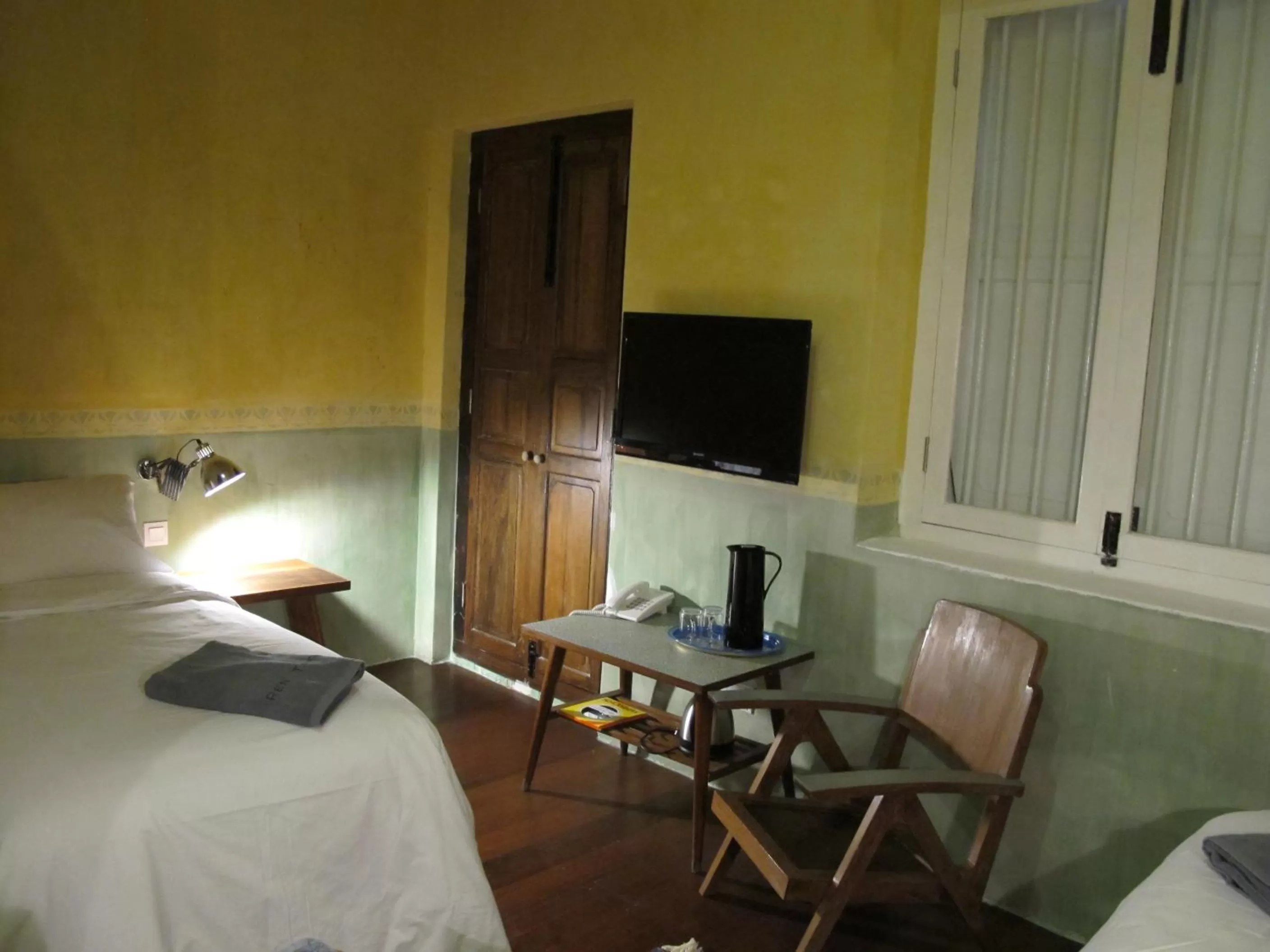 Bed in Ren I Tang Heritage Inn