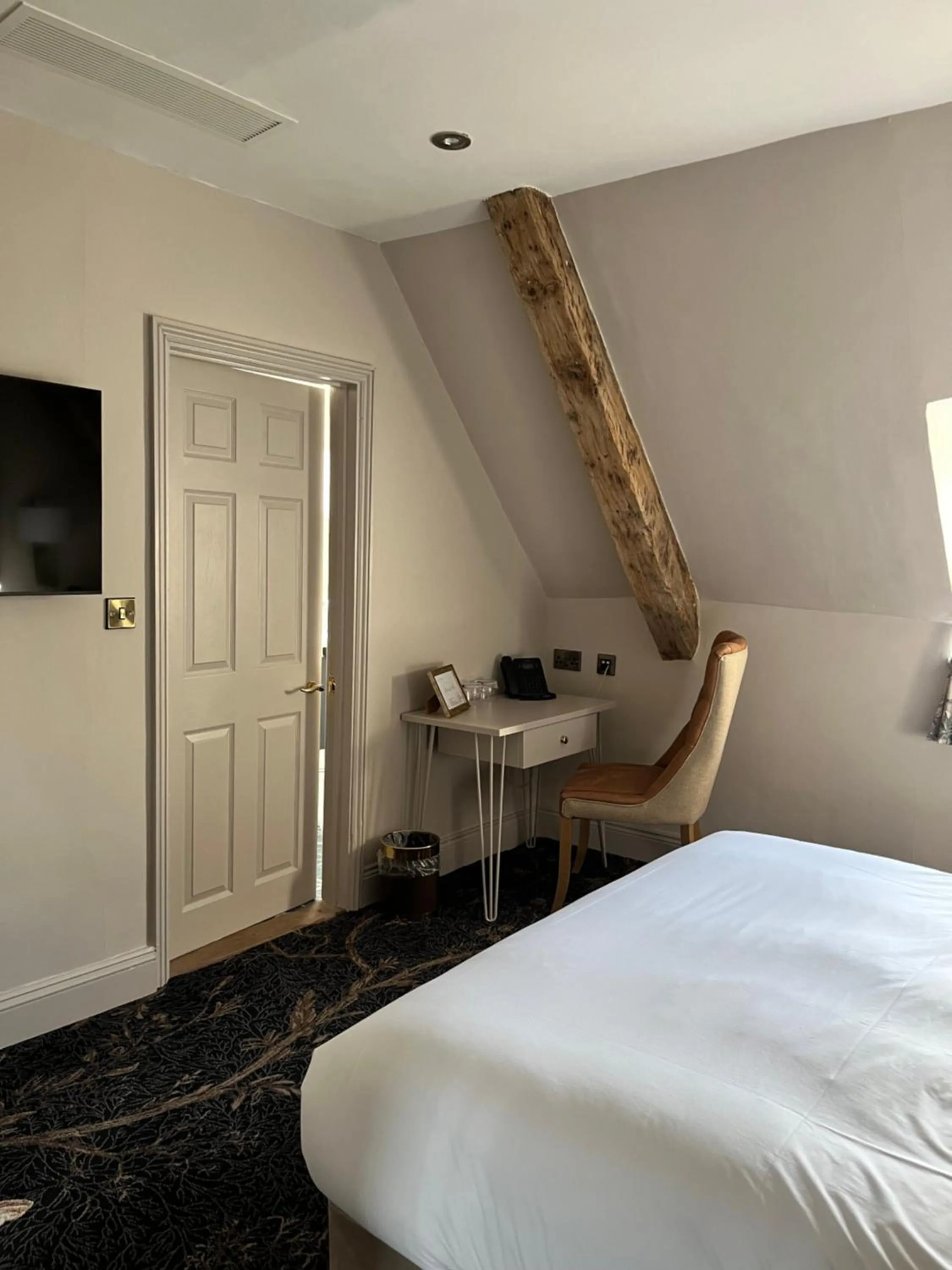 Bed in The Haycock Manor Hotel