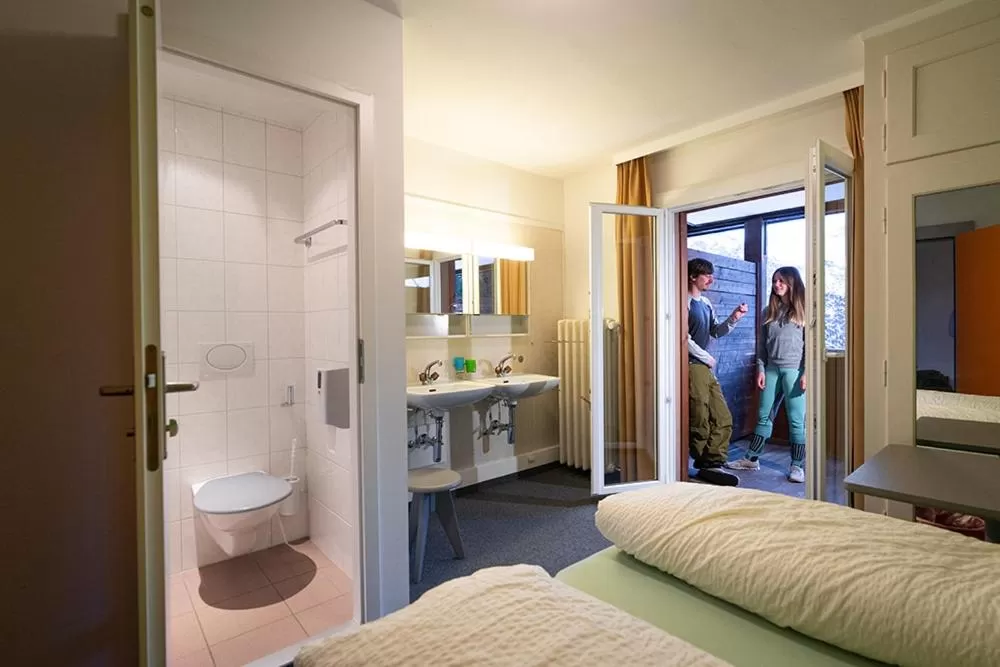 Photo of the whole room, Bed in Arosa Mountain Lodge