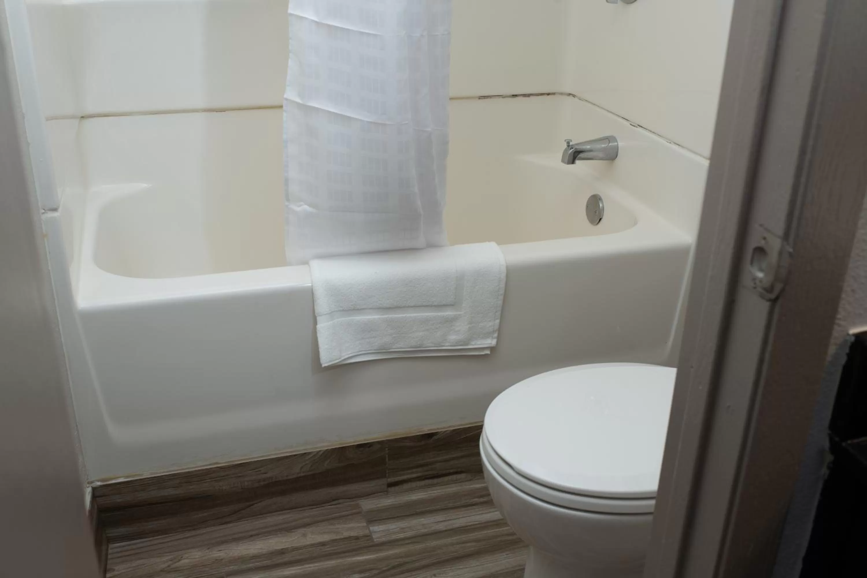 Toilet in AmericInn by Wyndham Madison WI