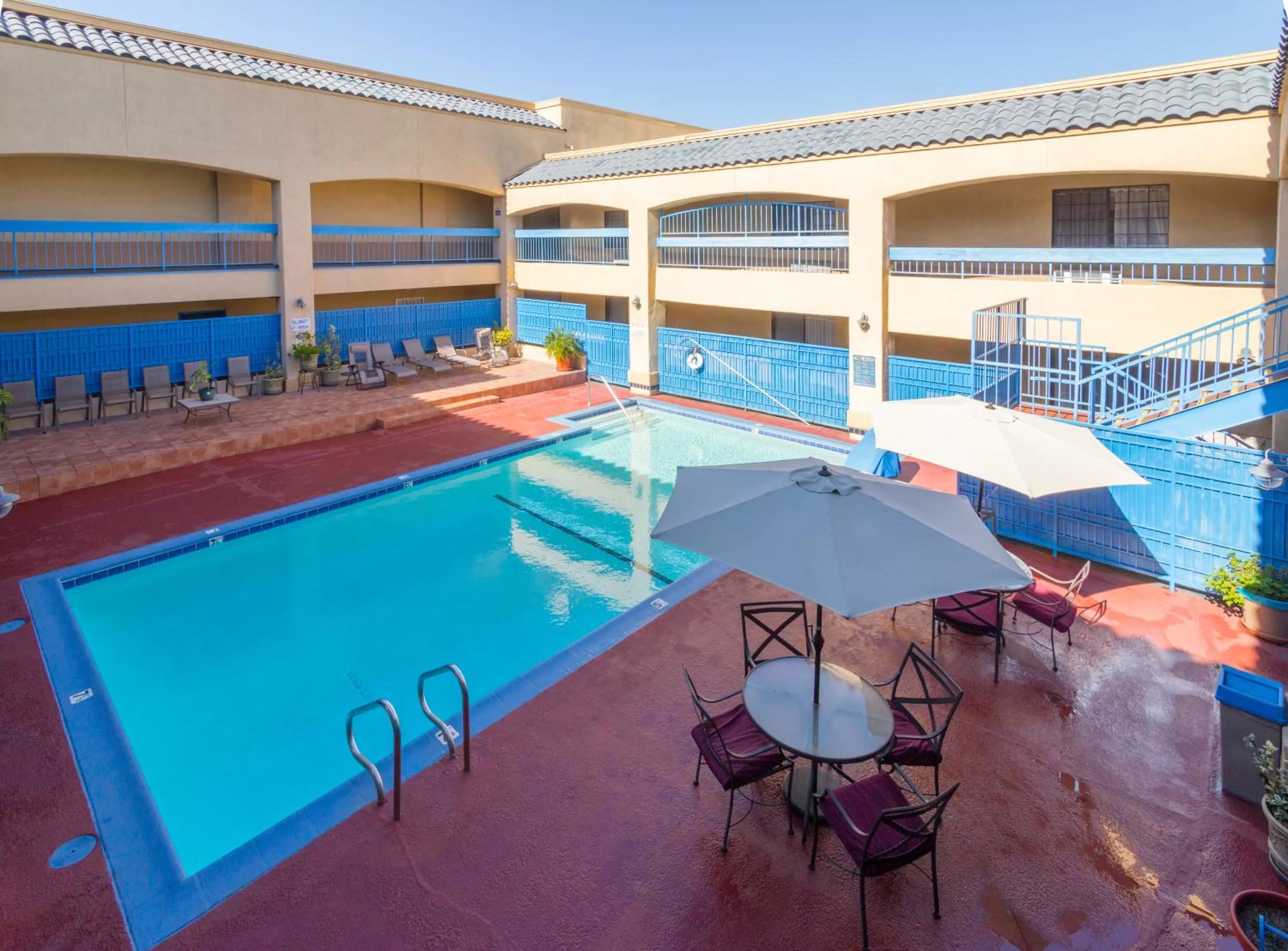 Swimming pool in Days Inn & Suites by Wyndham Artesia