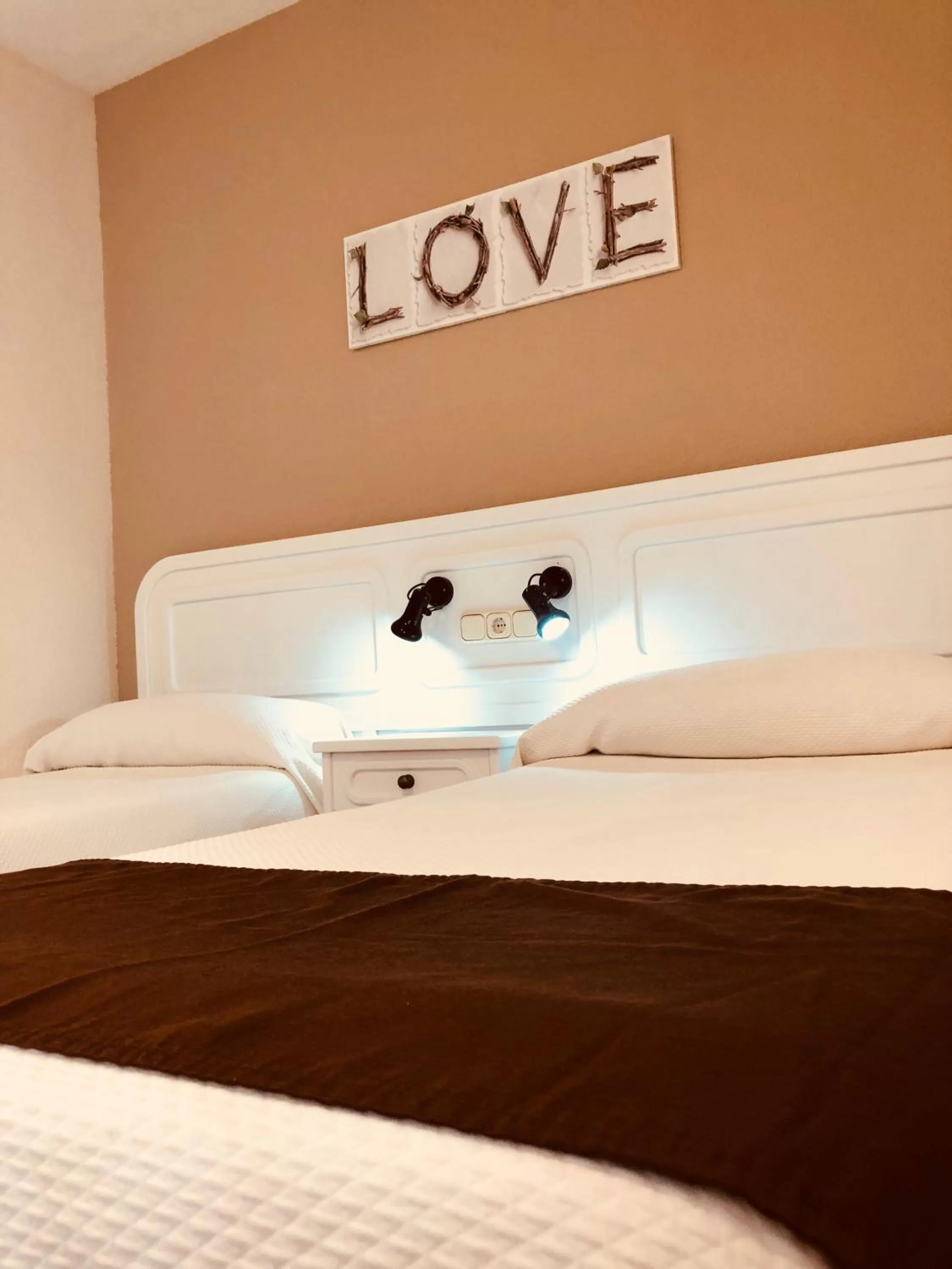 Bed in Regency Torviscas Apartments and Suites