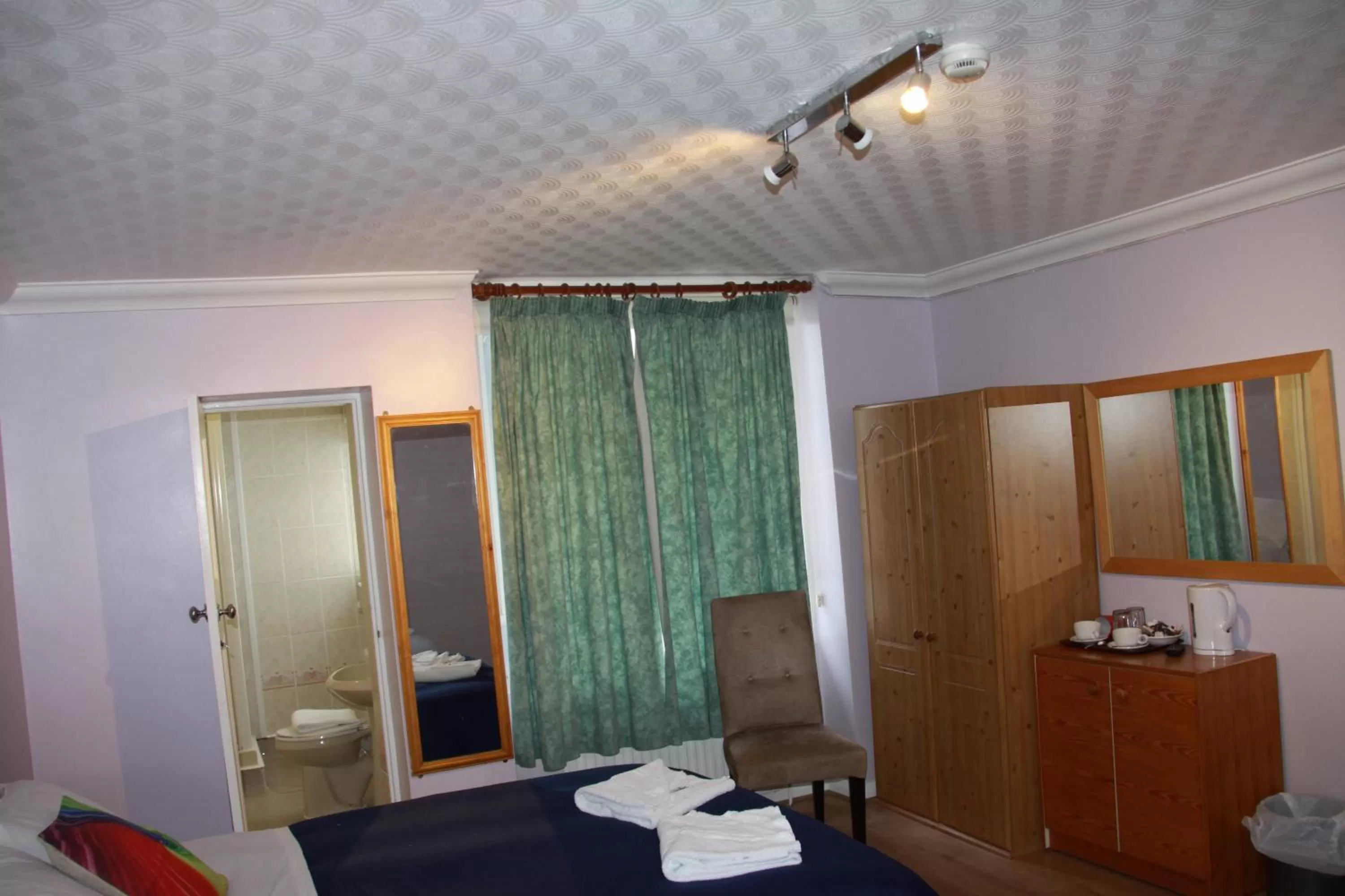 Bed in Ambassador Hotel