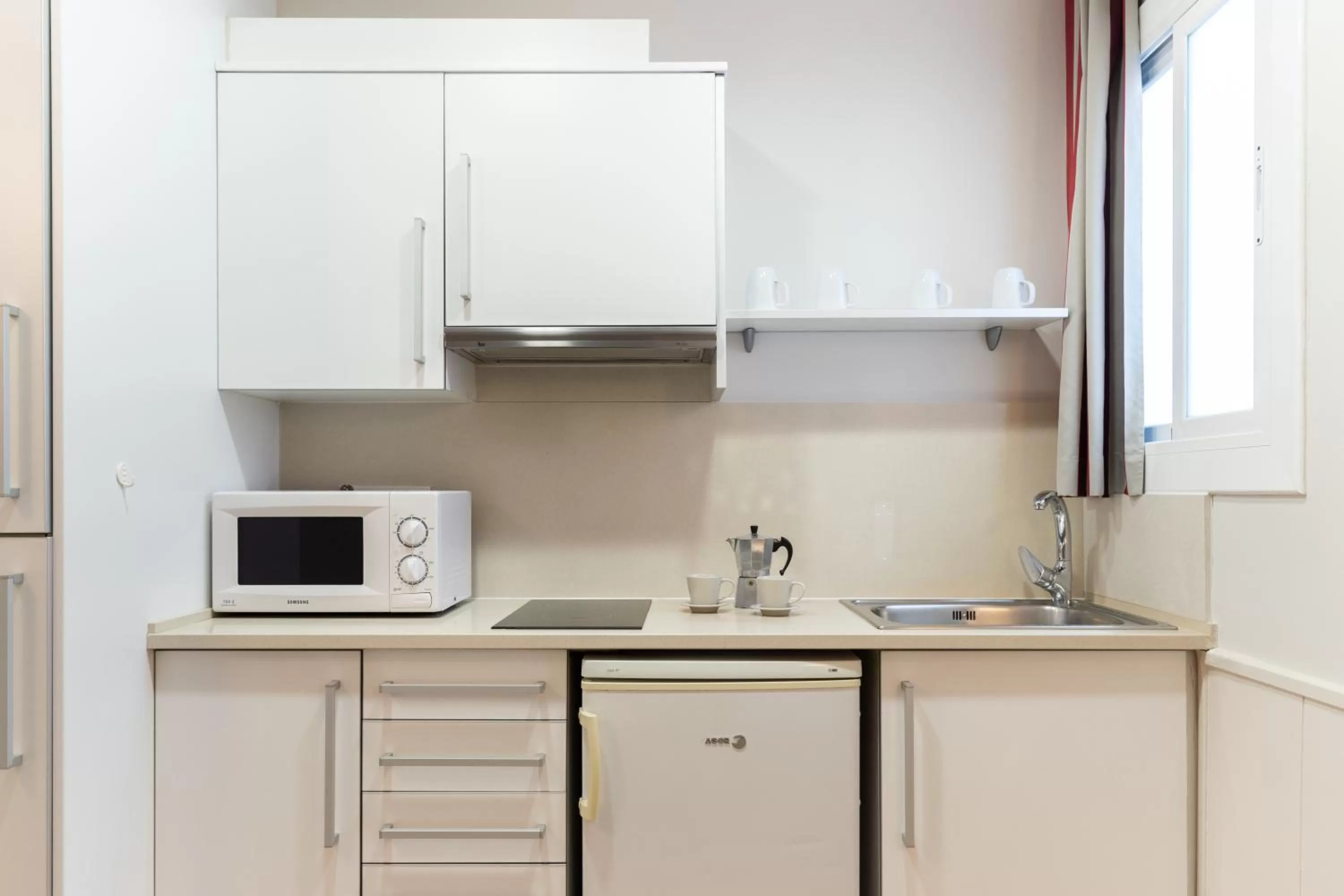 Kitchen or kitchenette in Atica Apartments - by Weflating