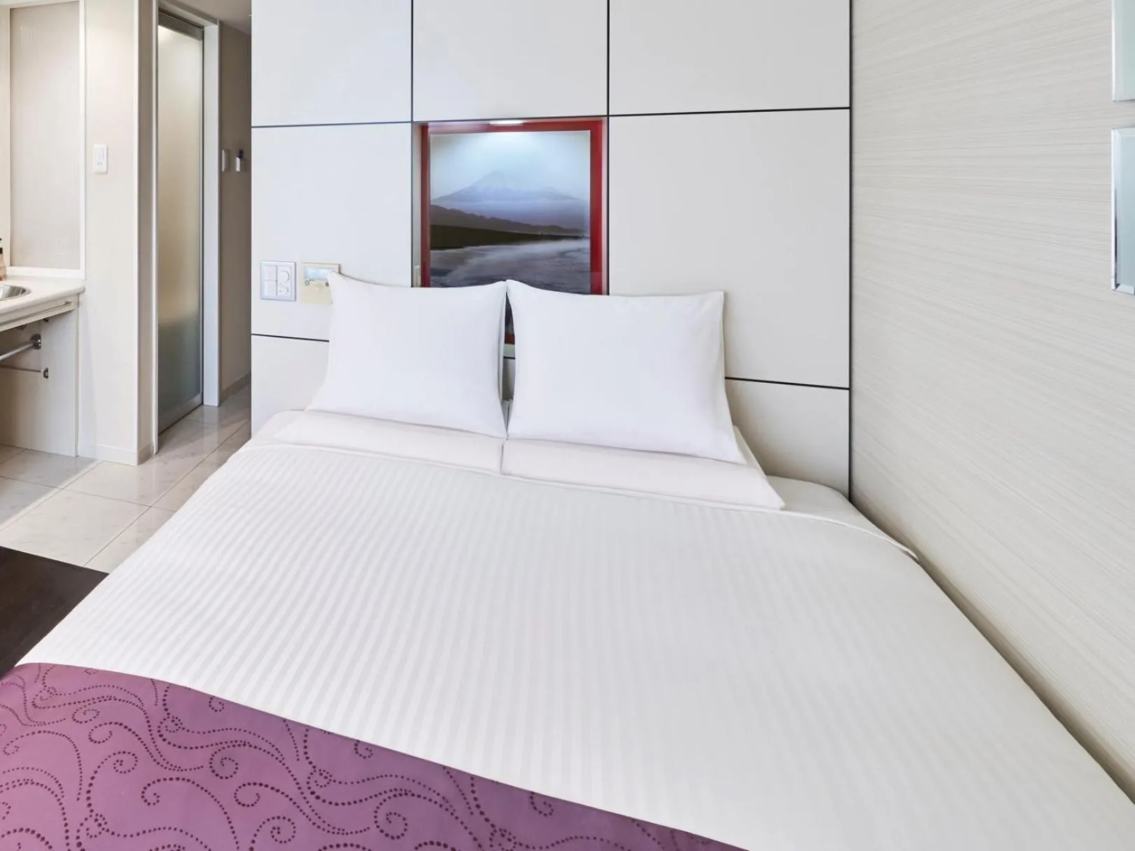 Bed in HOTEL MYSTAYS Shimizu