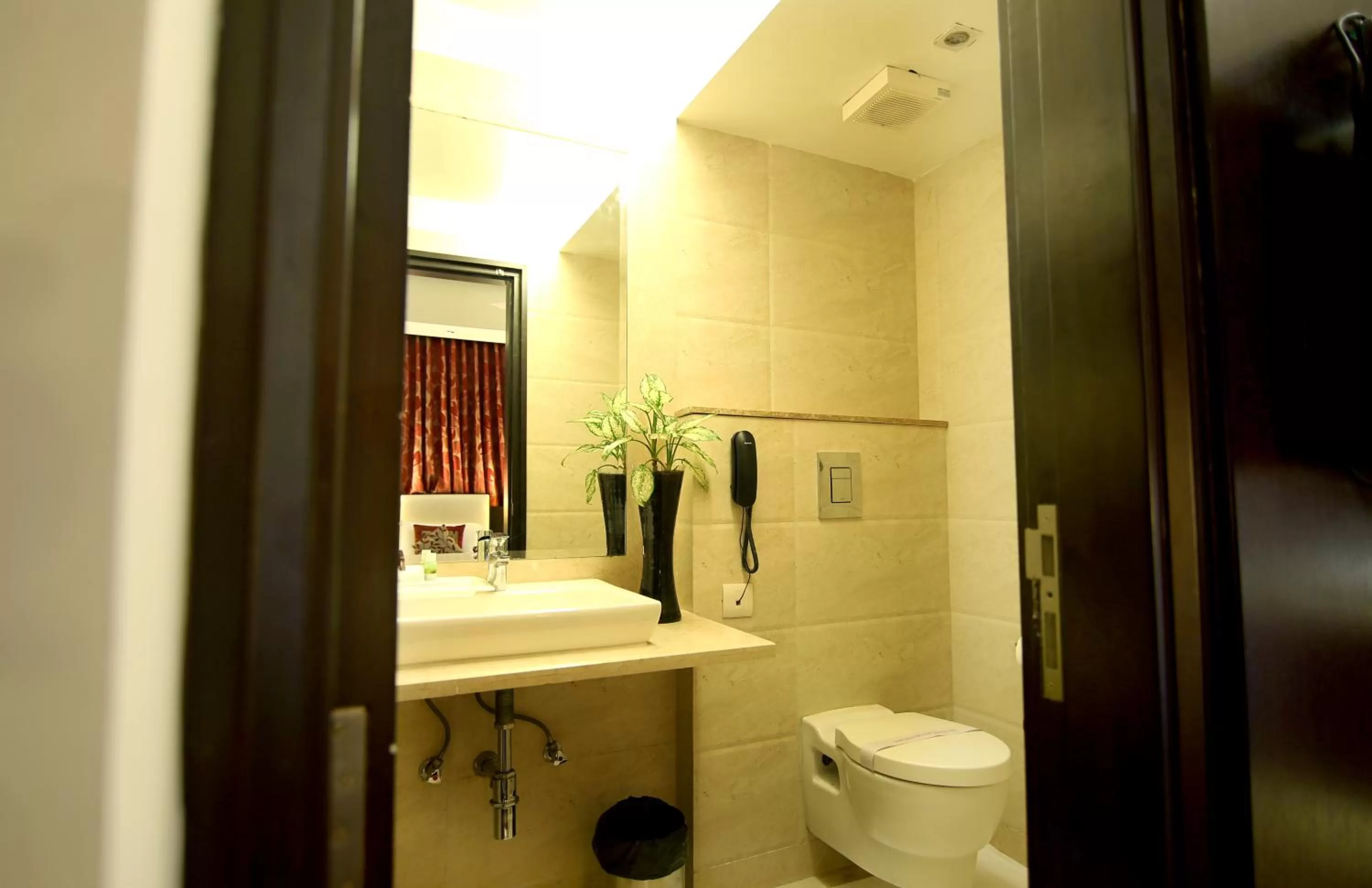 Bathroom in Hotel The Prime Balaji Deluxe, City Centre, With Free Airport Pickup