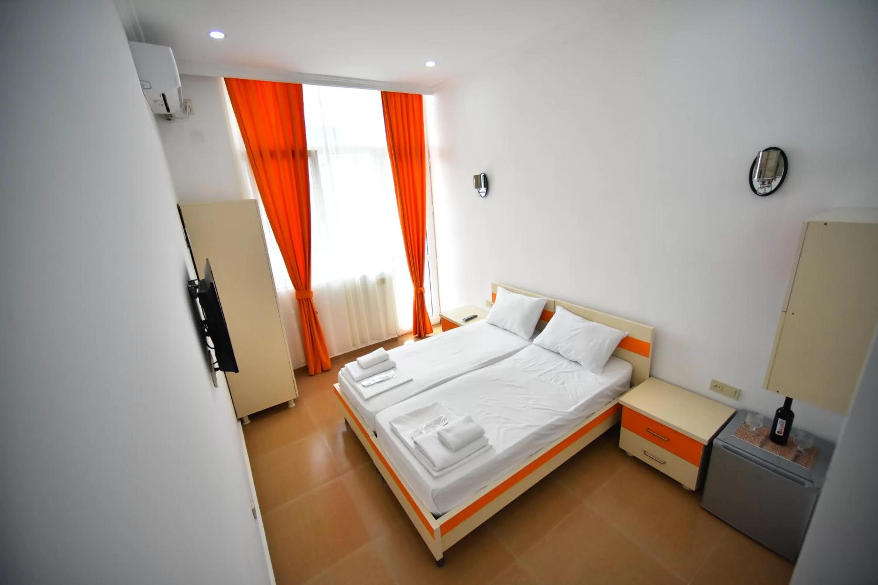 Bed in Orange Home Hotel