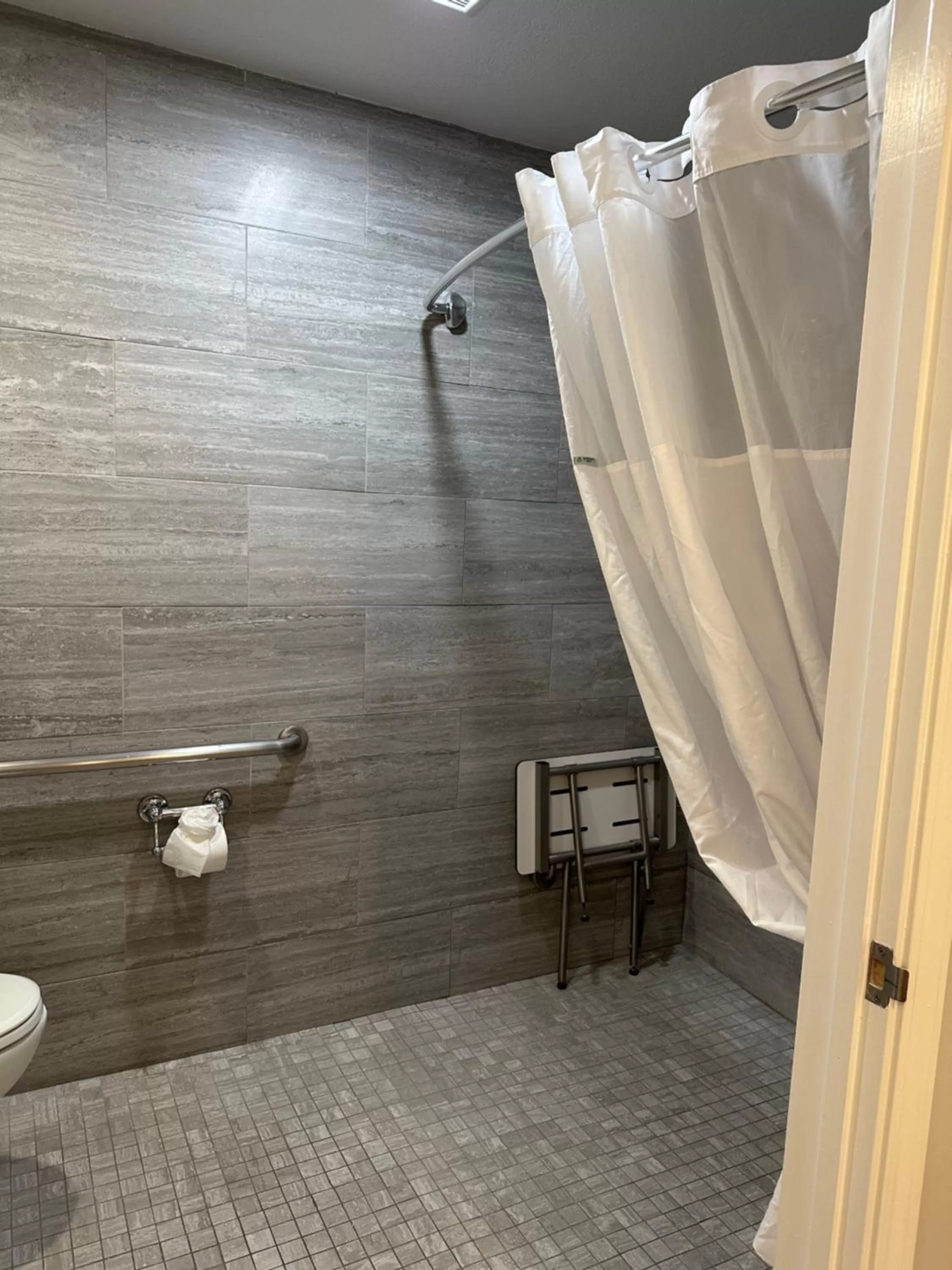 Bathroom in Super 8 by Wyndham San Bruno /SF Intl Arpt West