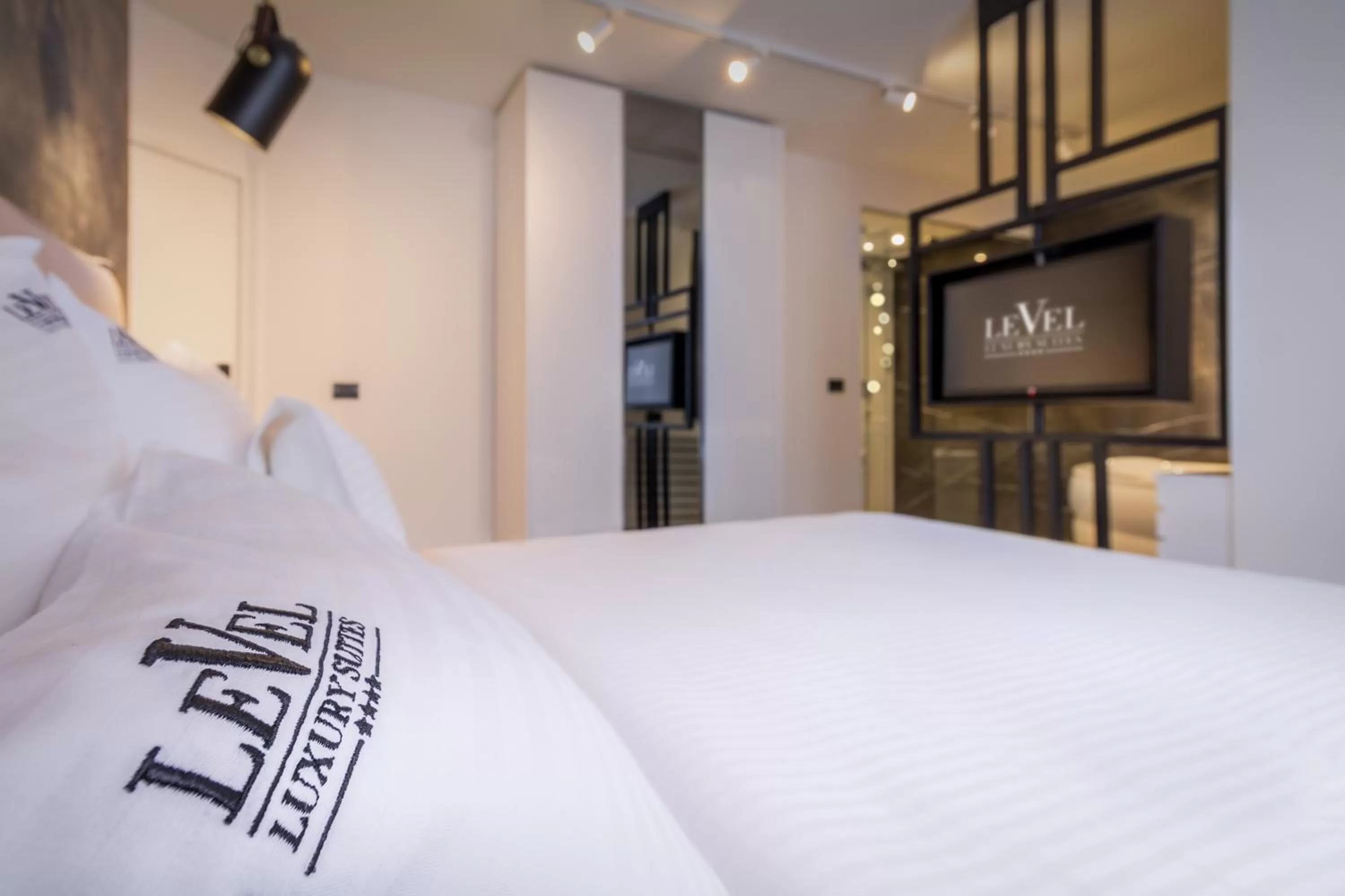 Bedroom, Bed in Level Luxury Suites