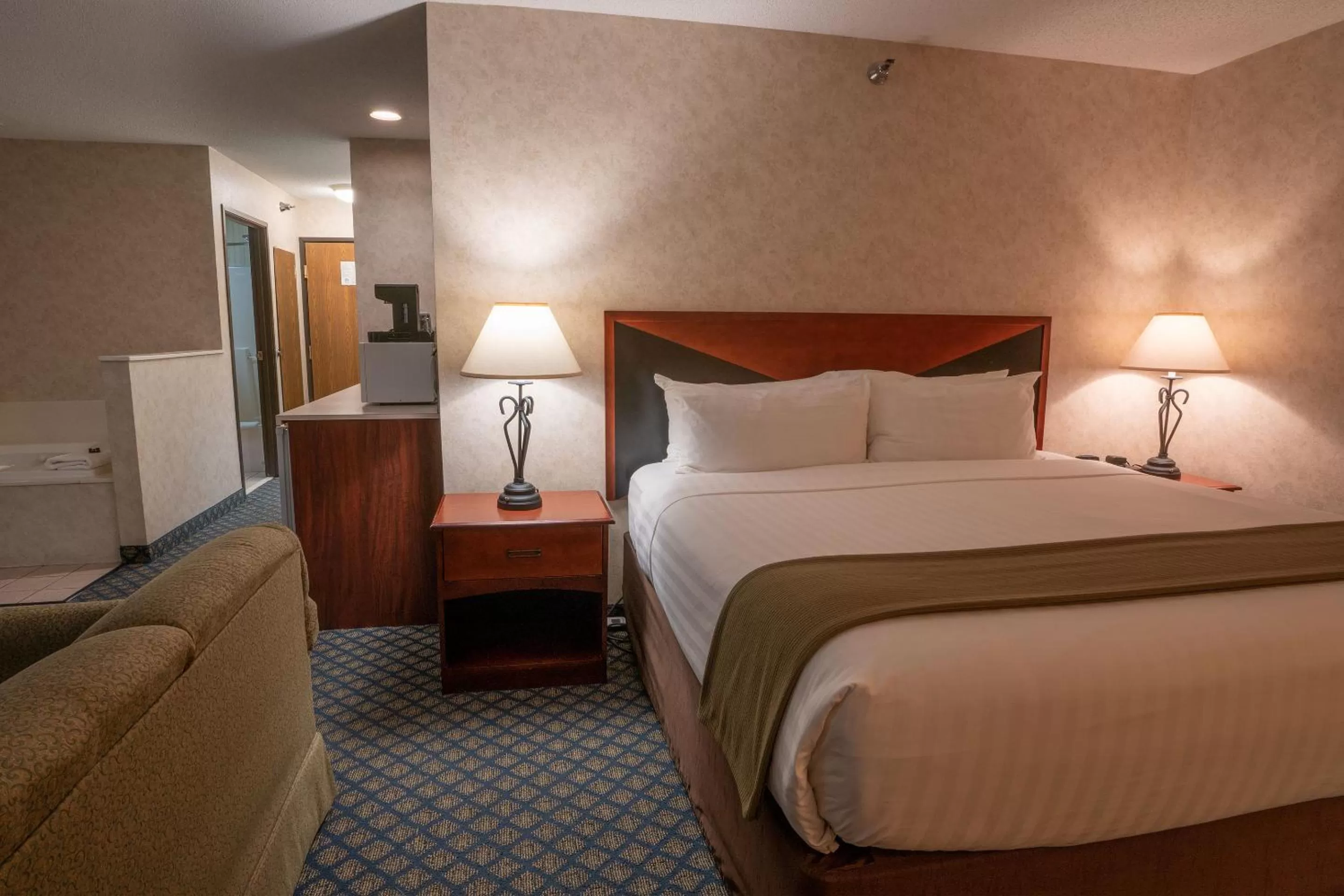 Bed in Miles City Hotel & Suites