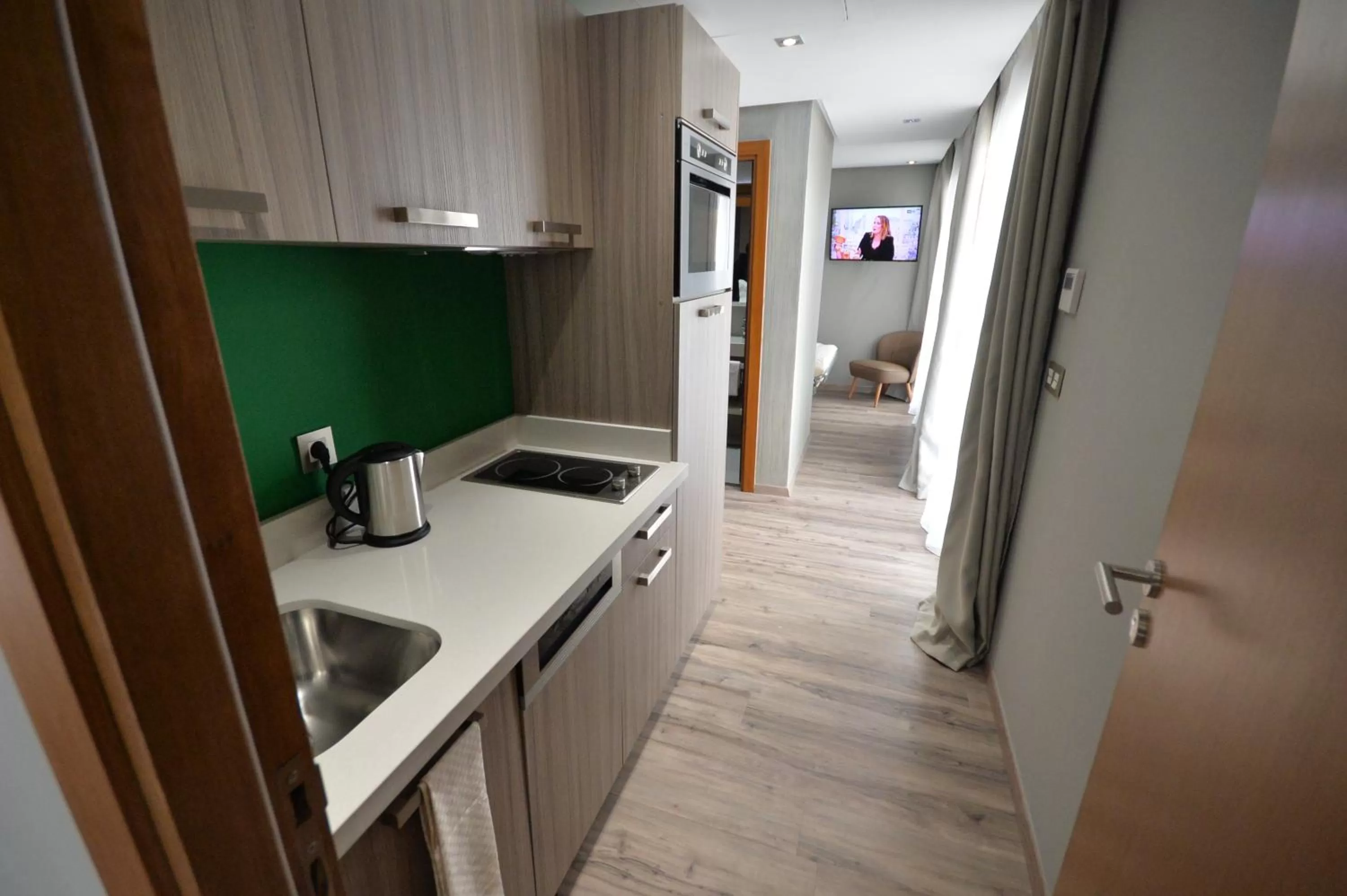 Kitchen or kitchenette in Le 22 Appart'Hotel
