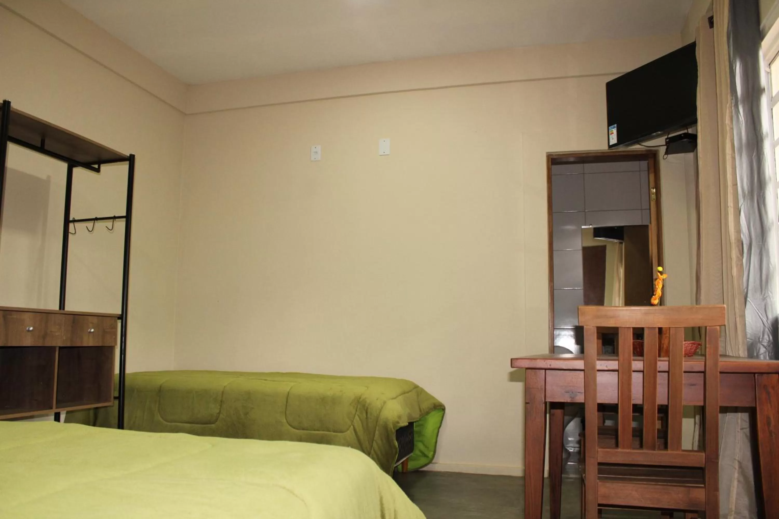 Bed in Pousada Morro dos Ventos