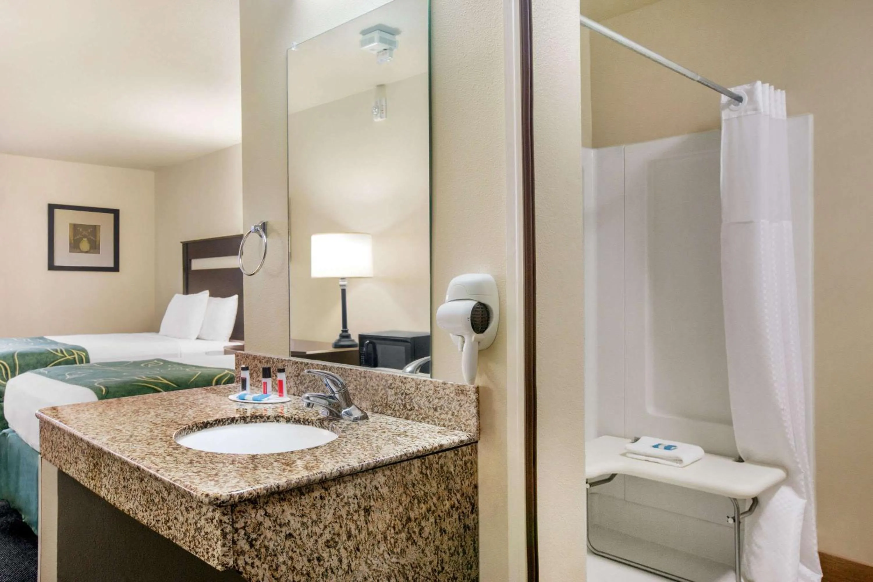 Bathroom, Bed in Travelodge by Wyndham Livonia