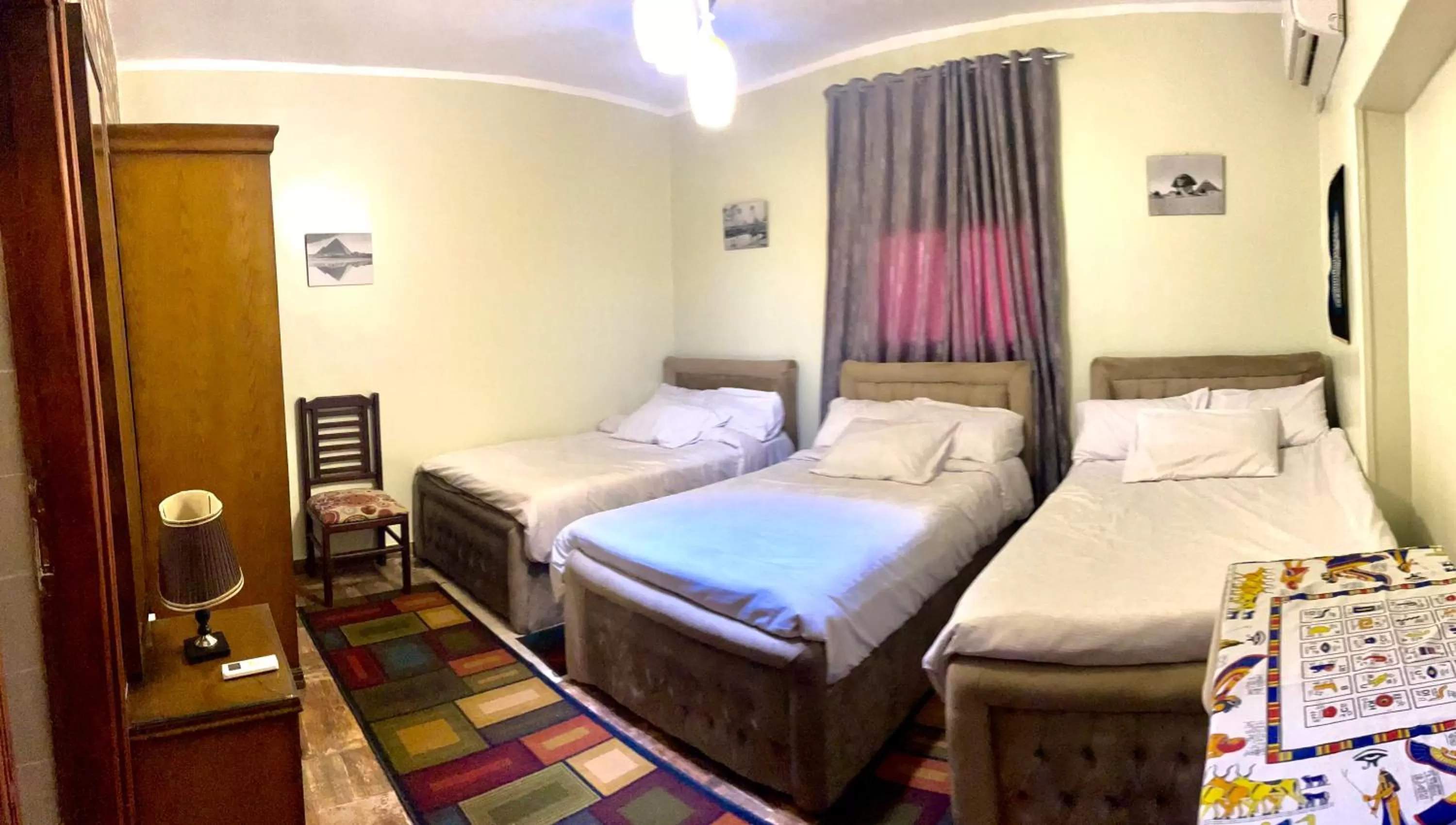 Bed in Sphinx palace pyramids view