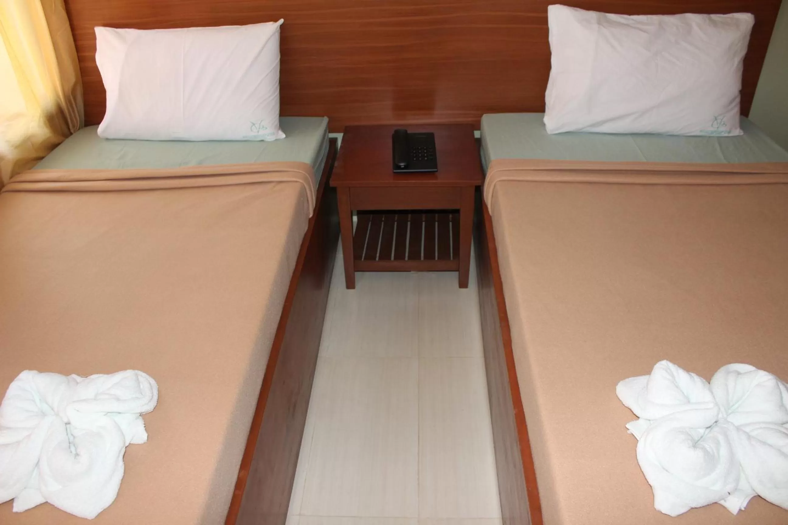 Bed in Coron Visitors Hotel