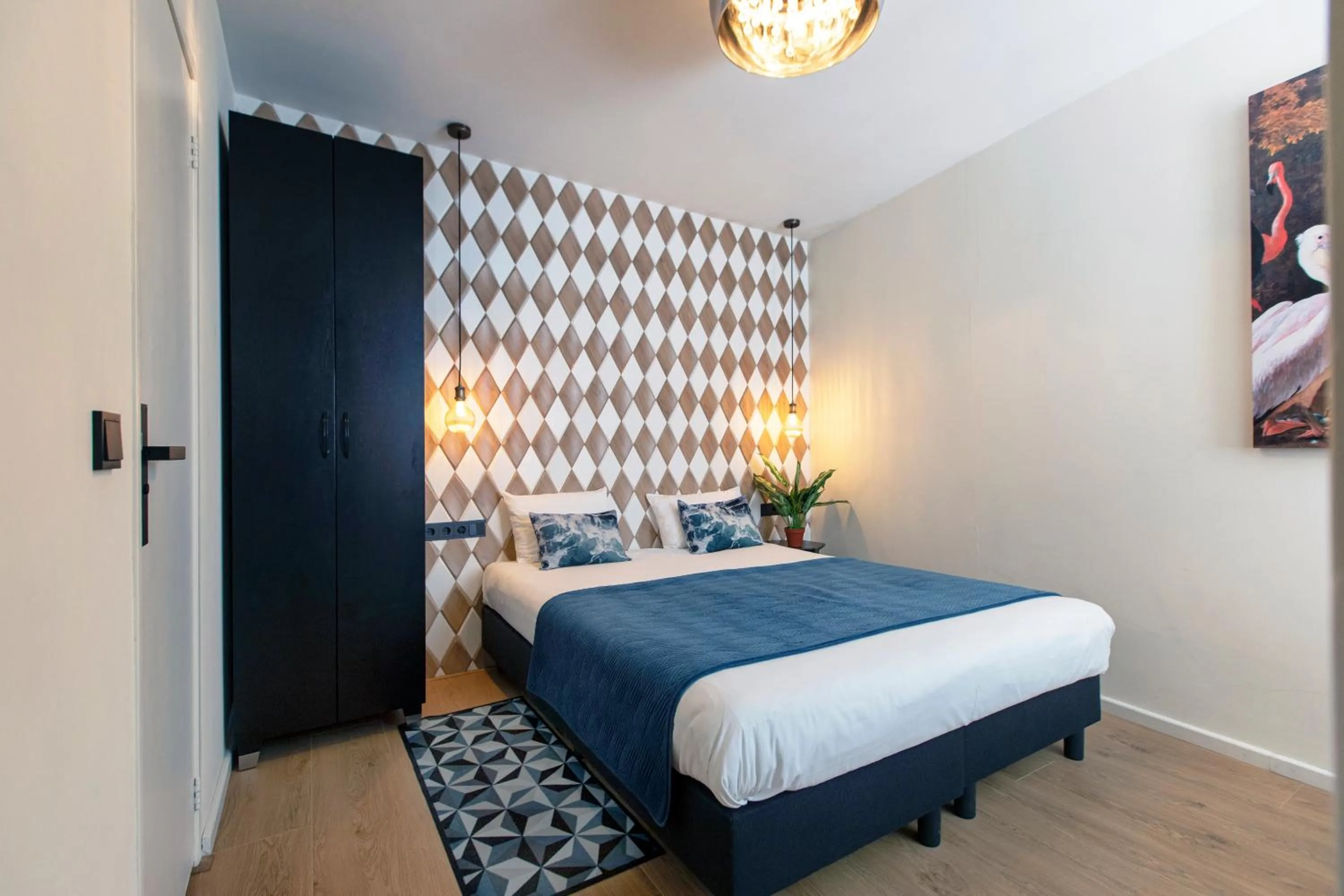 Bed in Quentin Golden Bear Hotel