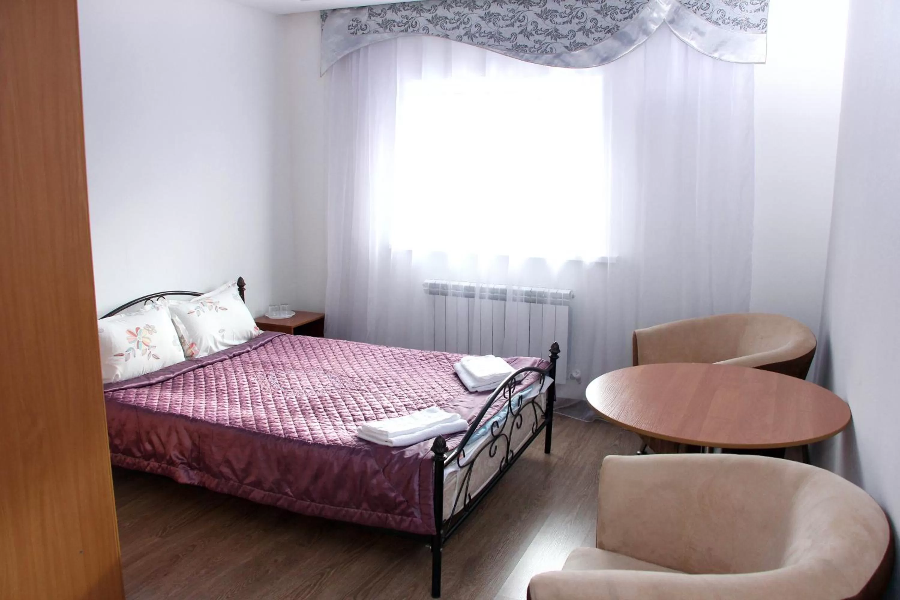 Bed in Zhaylau Hotel