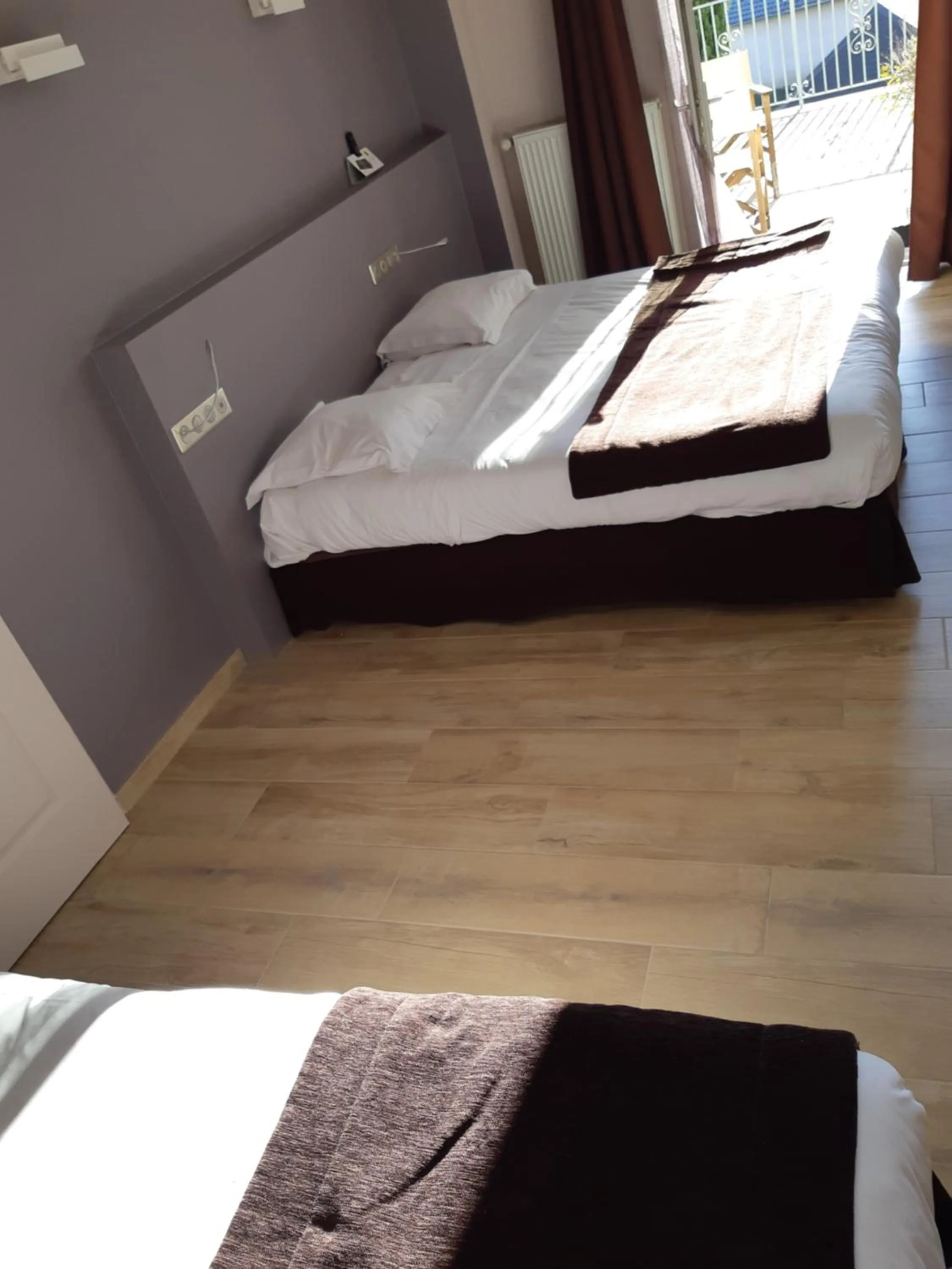 Patio, Bed in Logis Auberge Saint Simond