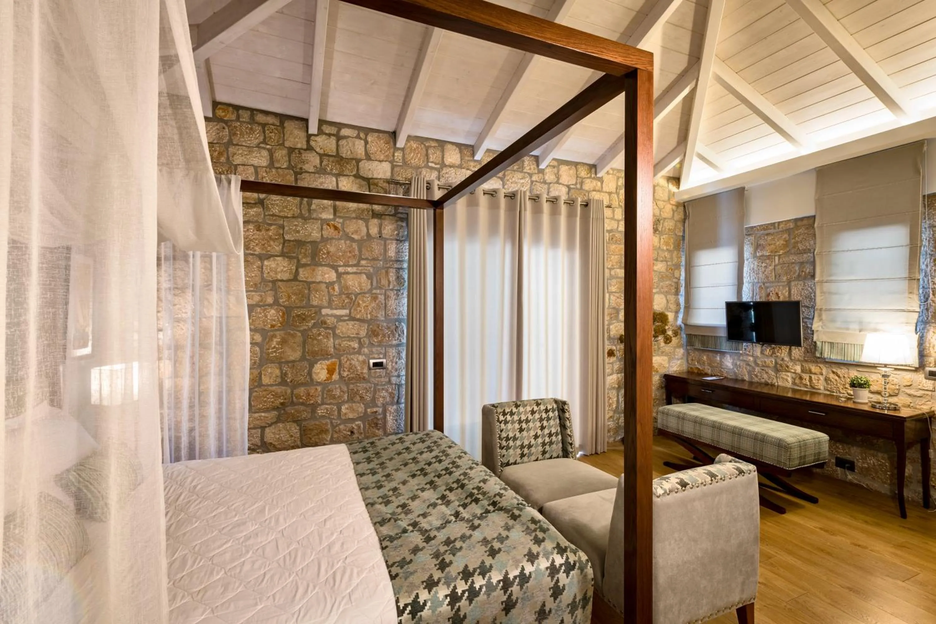 Bed in Anthemion Suites and Villas