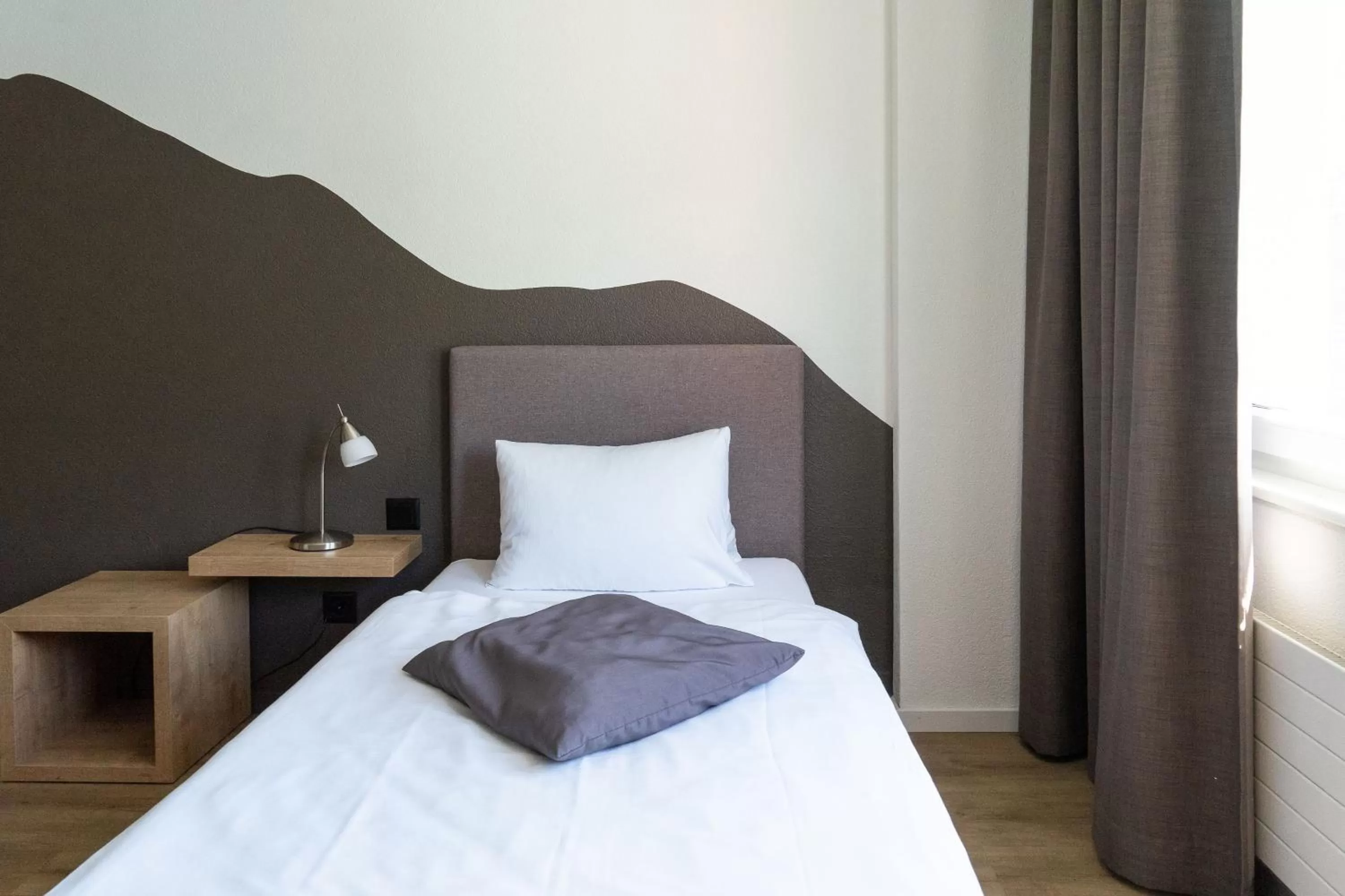 Bed in Tailormade Hotel STANS SÜD