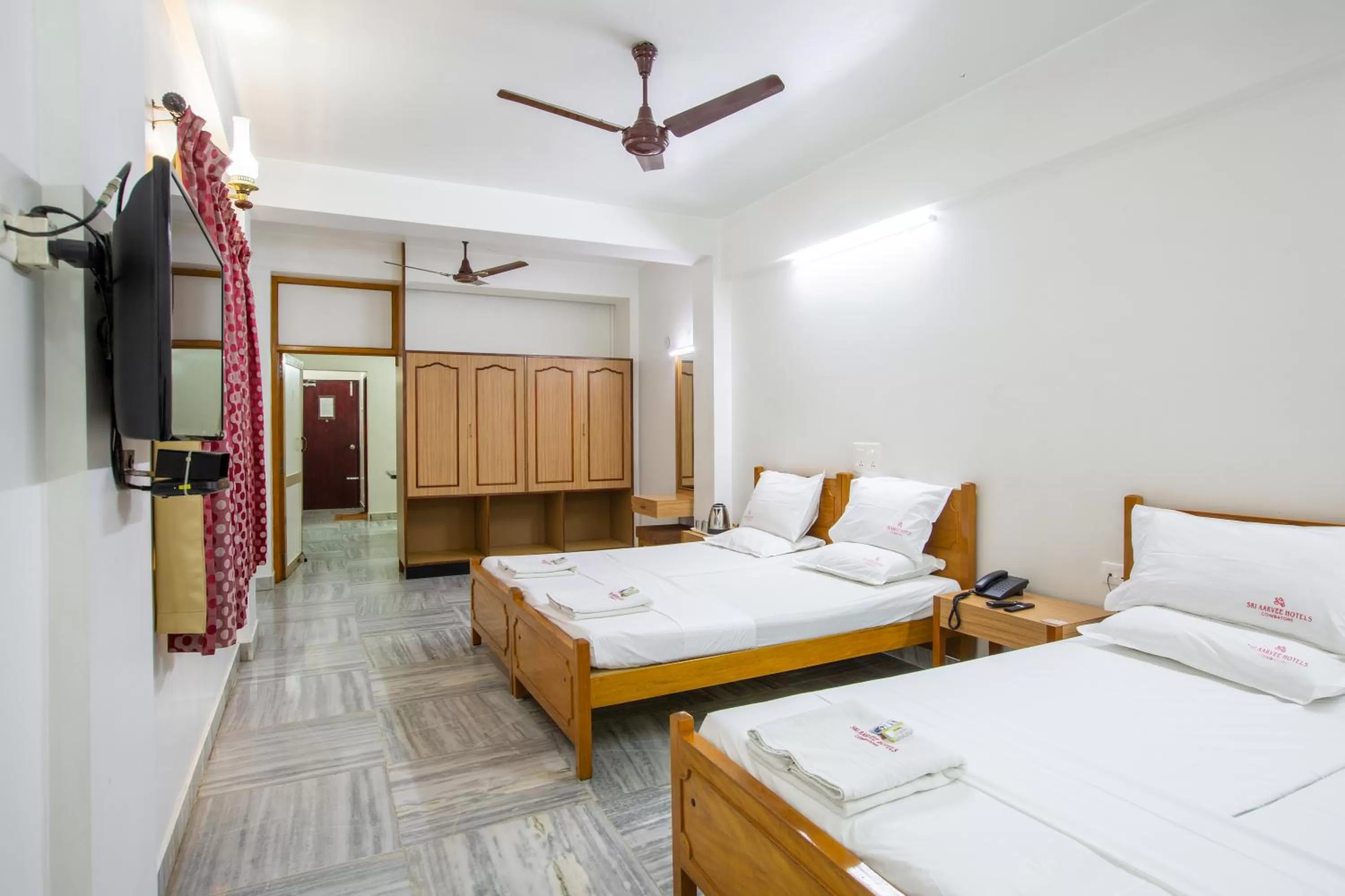 Bed in Sri Aarvee Hotels