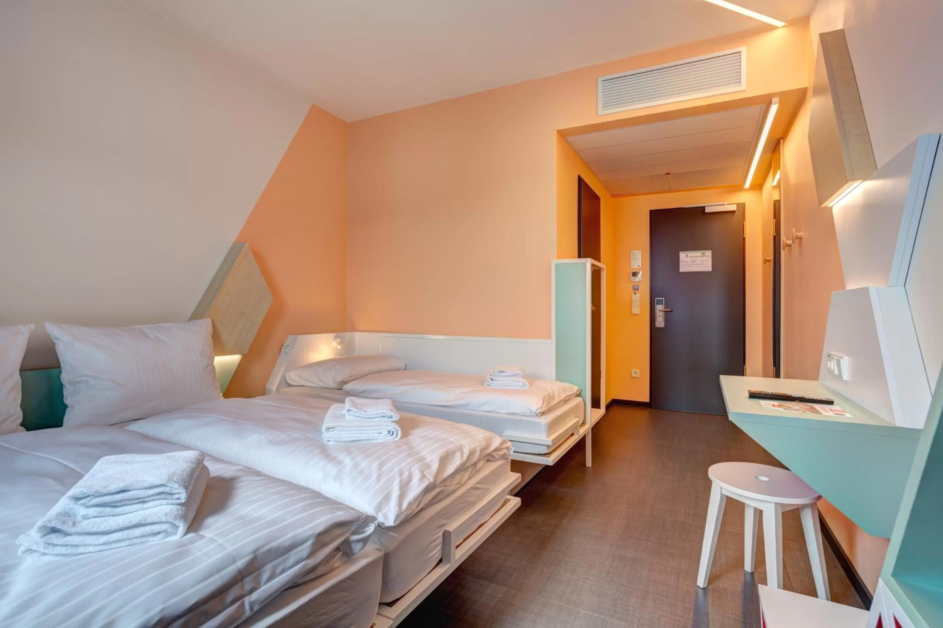 Photo of the whole room, Bed in MEININGER Hotel Heidelberg Hauptbahnhof