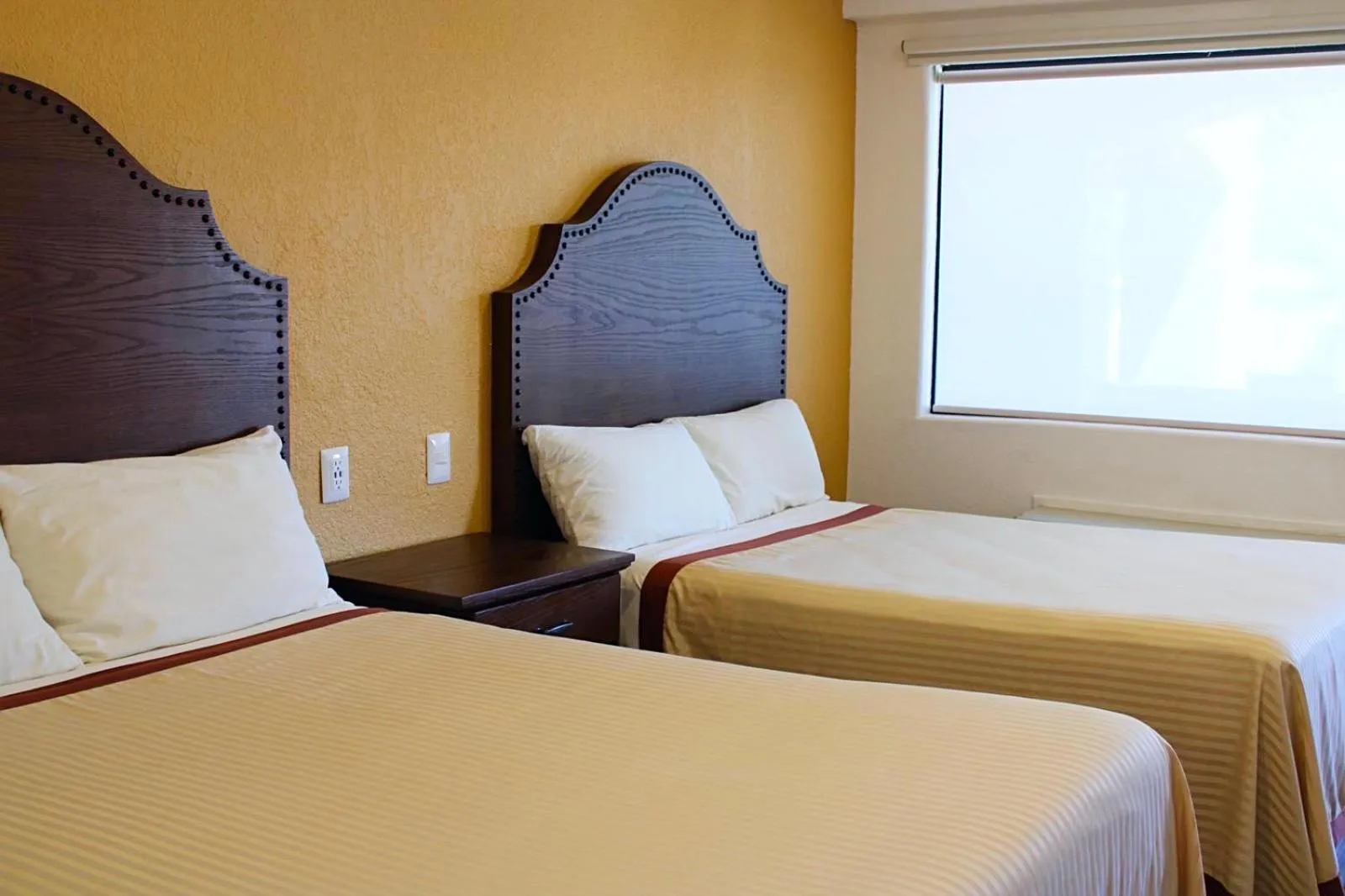 Bedroom, Bed in Estancia Inn