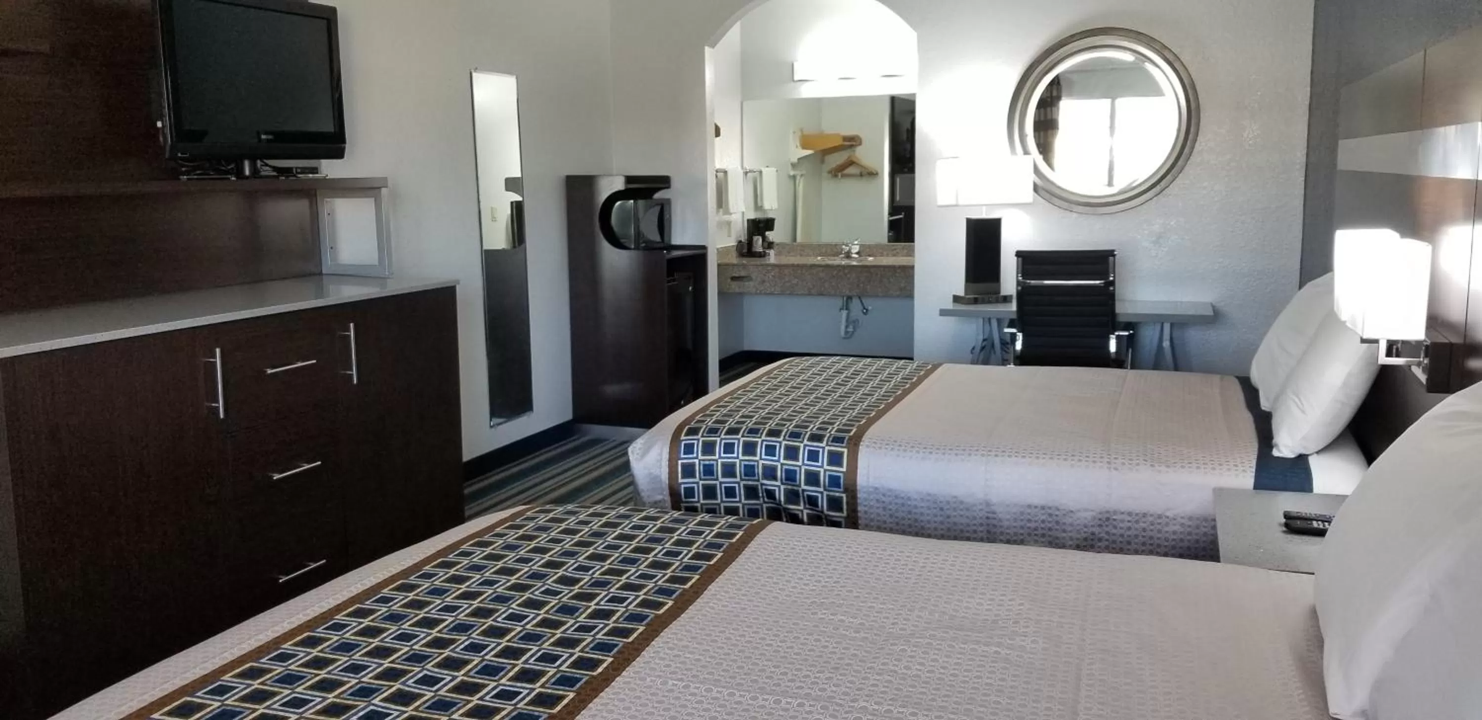 Bed in HomeBridge Inn and Suites