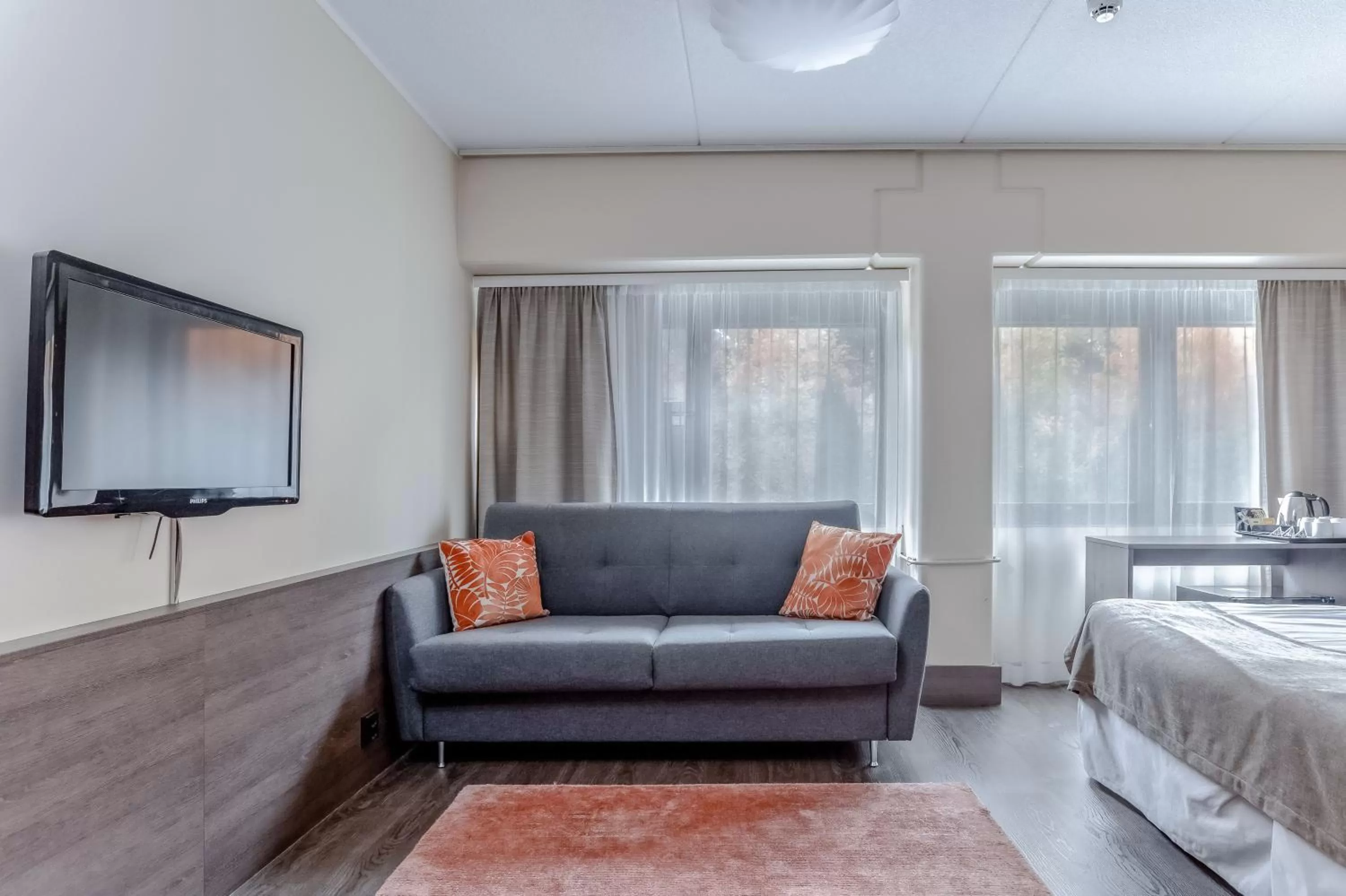 Seating area, Bed in Holiday Club Turun Caribia