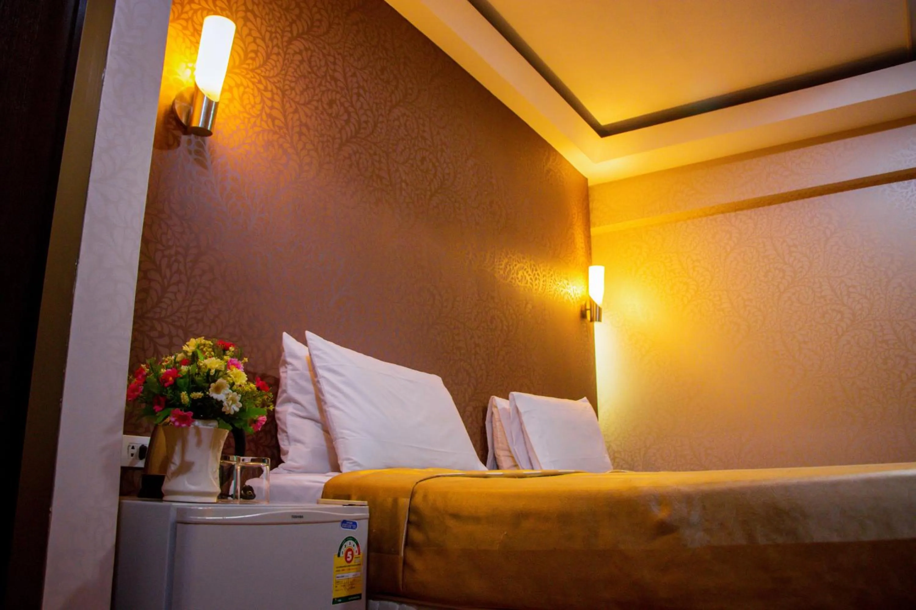 Bed in Visiting Card Hotel & Resort