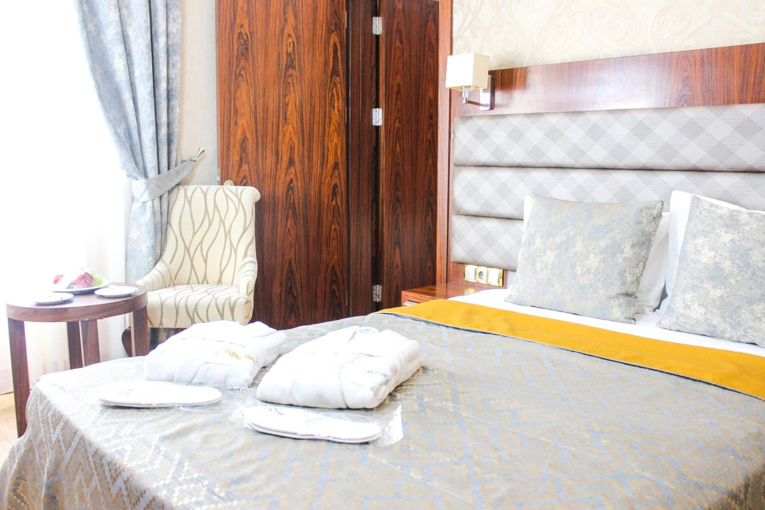 Bed in MidMar Deluxe Hotel