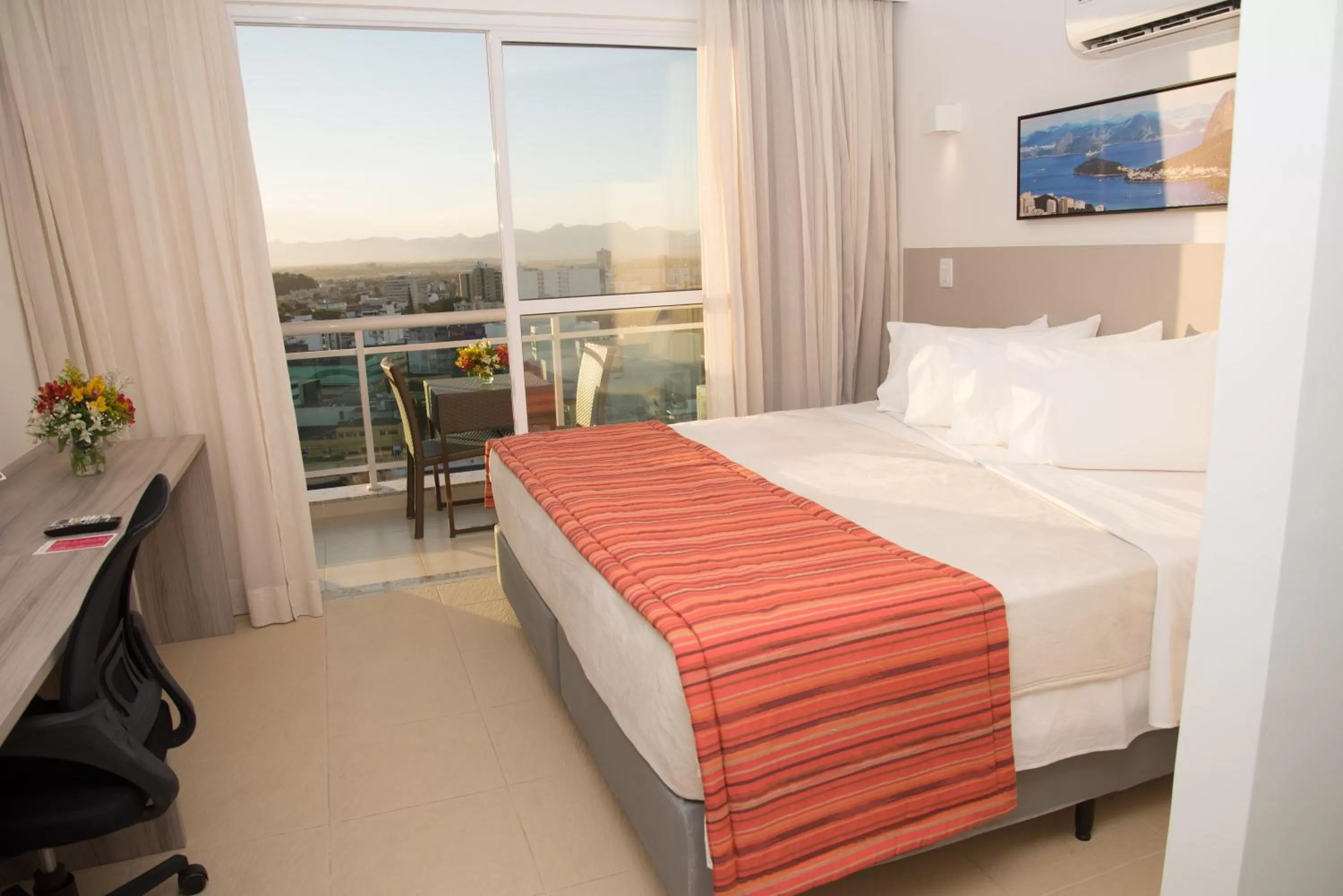 Bed in Ramada by Wyndham Macae Hotel & Suites