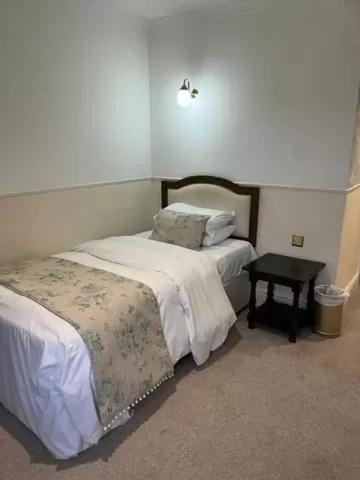 Bed in The Saracens Head Hotel