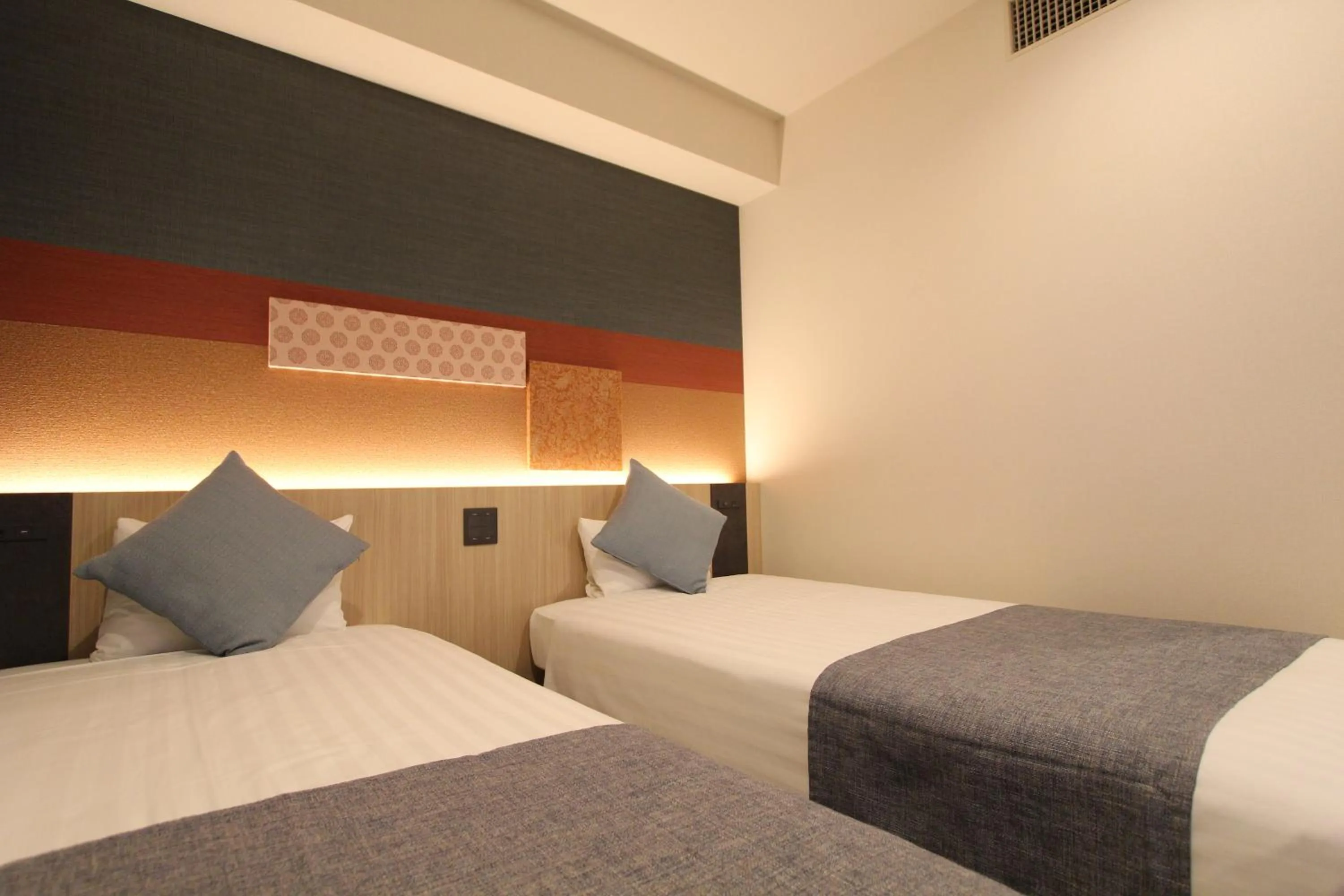 Bed in KOKO HOTEL Tsukiji Ginza