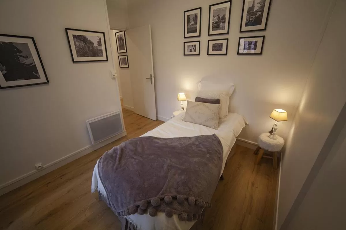 Bed in Bienvenue Chez Nous