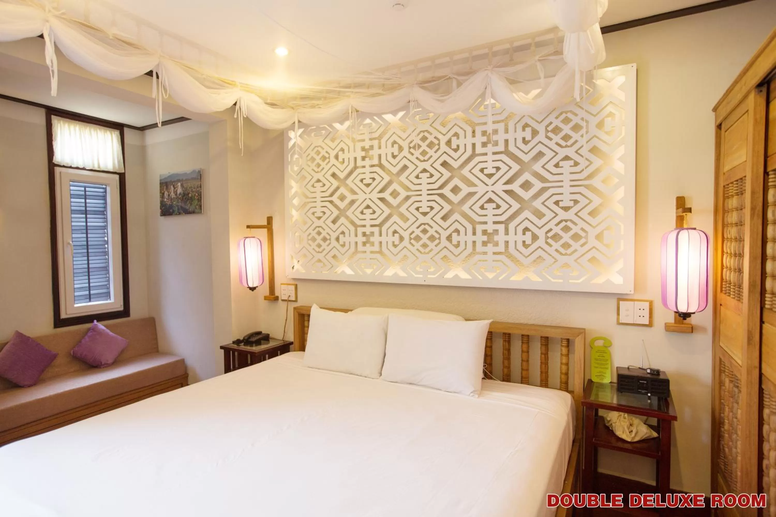 Bed in Hoi An Pho Library Hotel