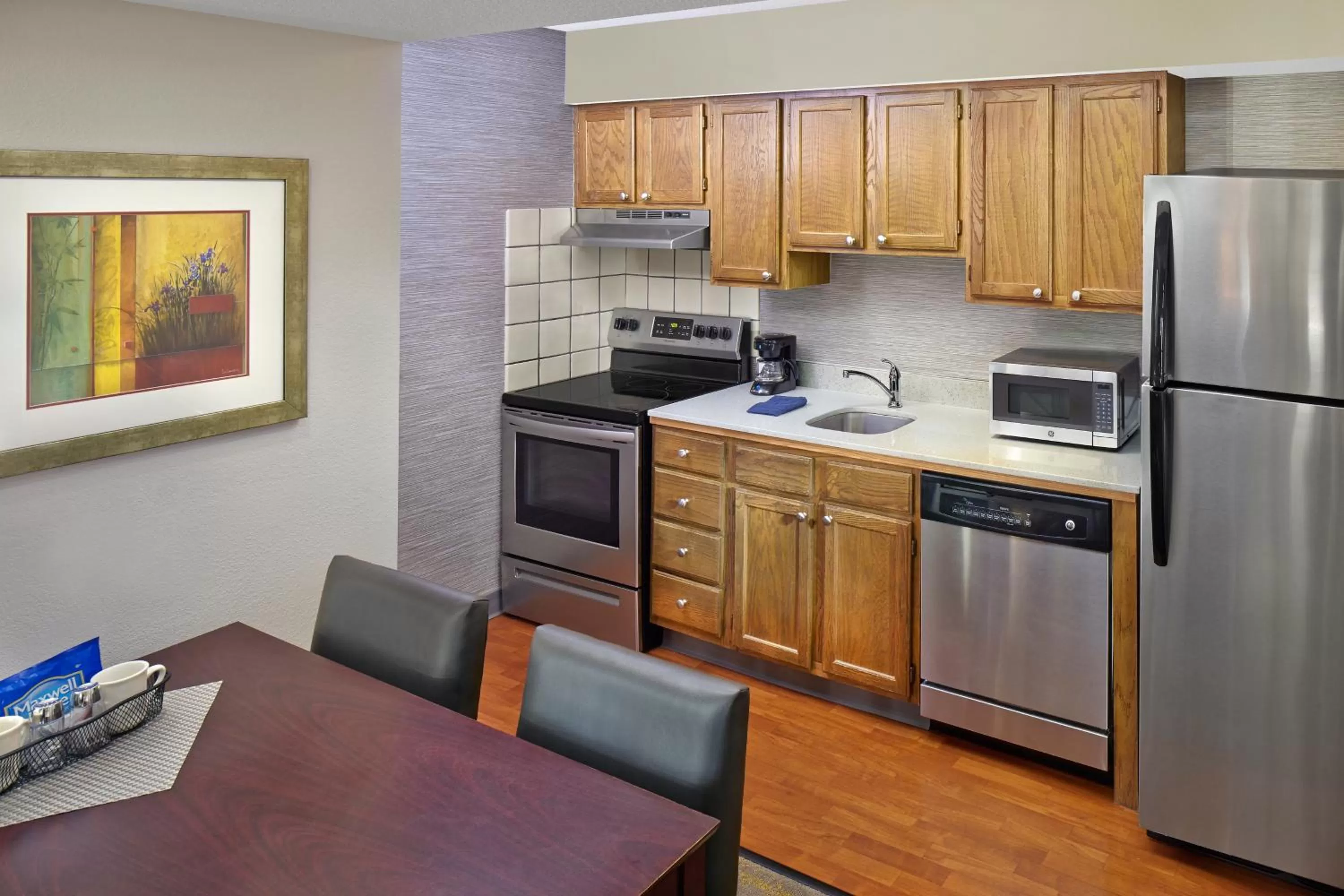 Kitchen or kitchenette in New Haven Village Suites