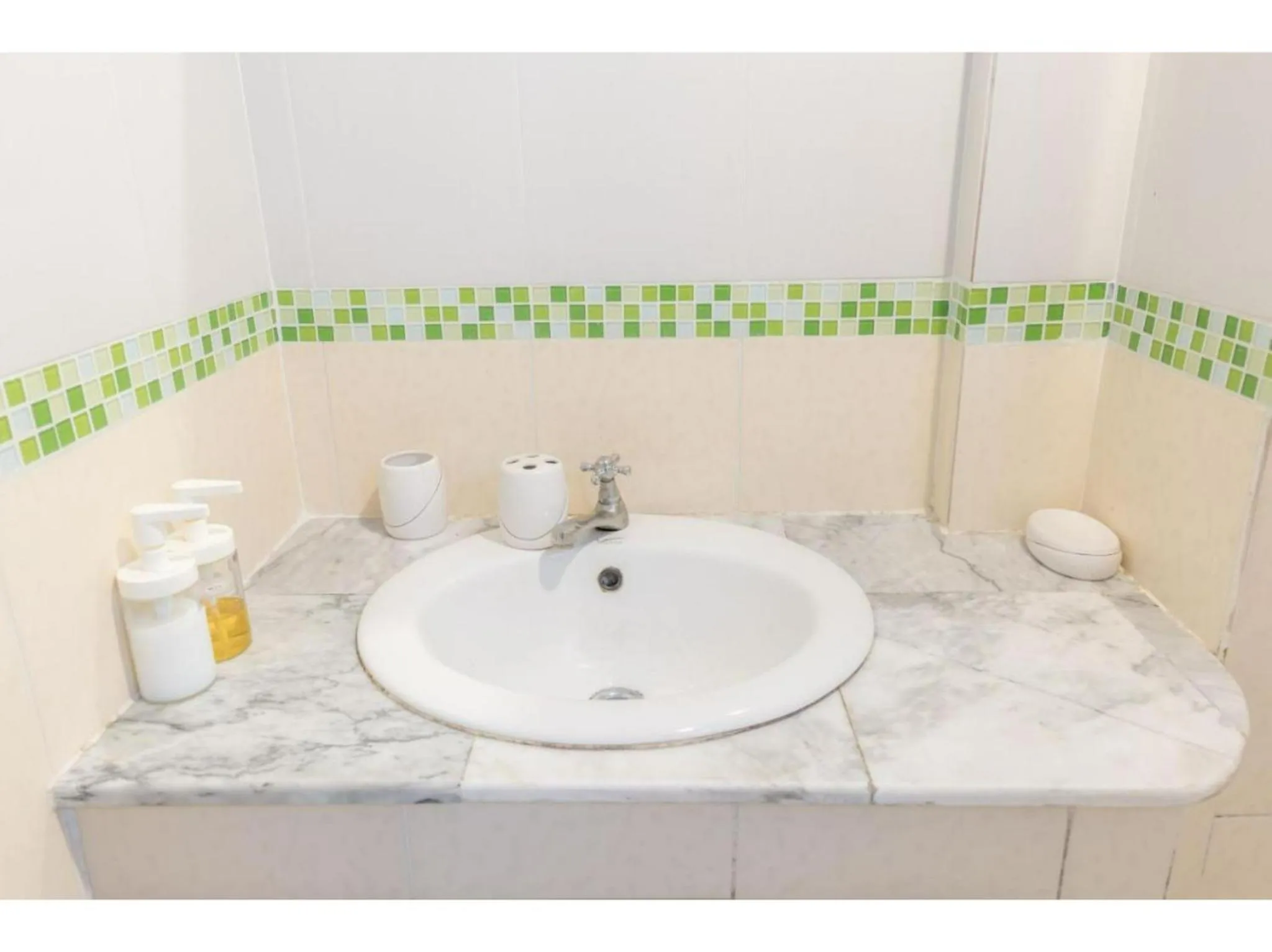 Bathroom in OYO 75405 Ladda Place