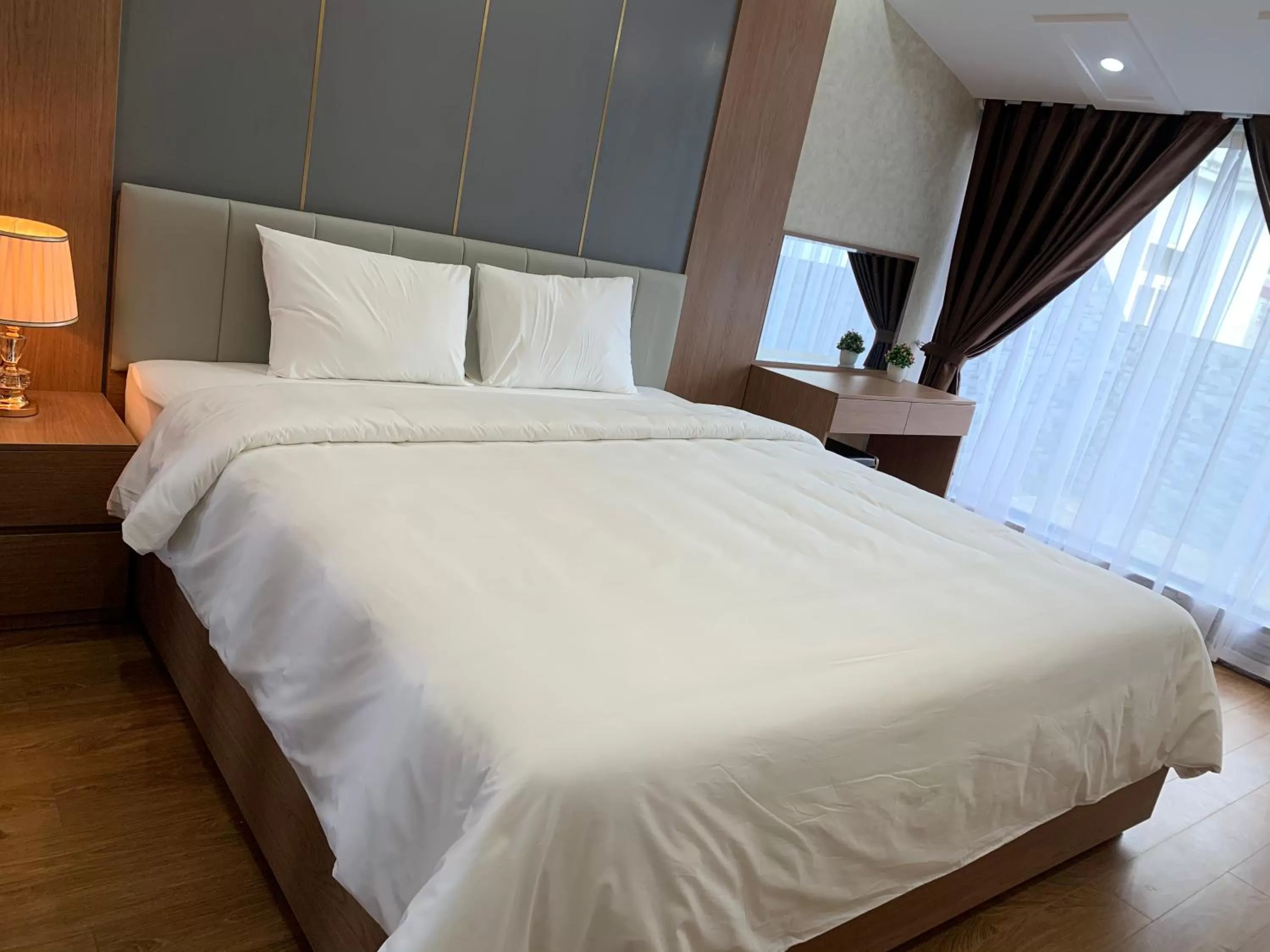 Bed in Galaxy Grand Hotel