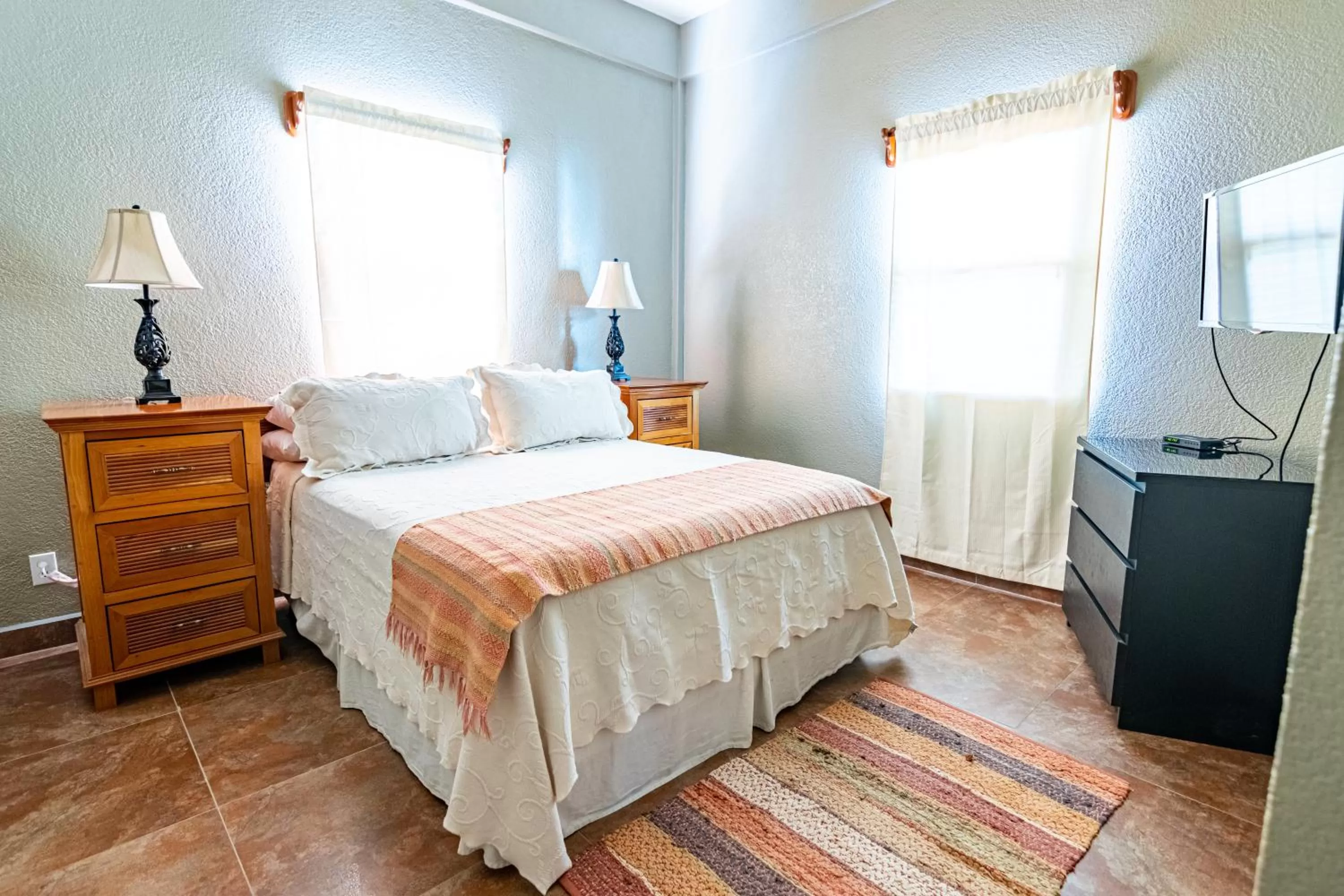 Bed in Lighthouse Beach Villas