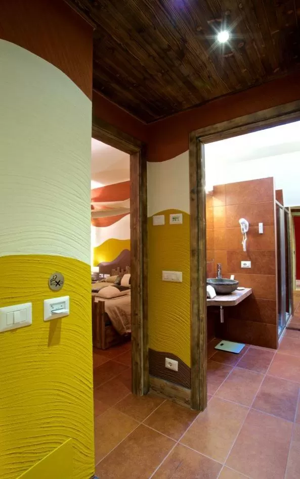 Photo of the whole room, Bed in Design Suite Tirano