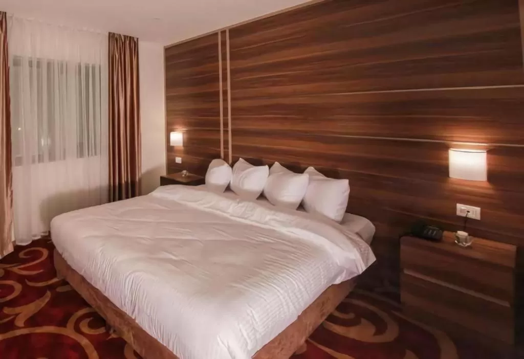 Bed in Spark Plaza Hotel